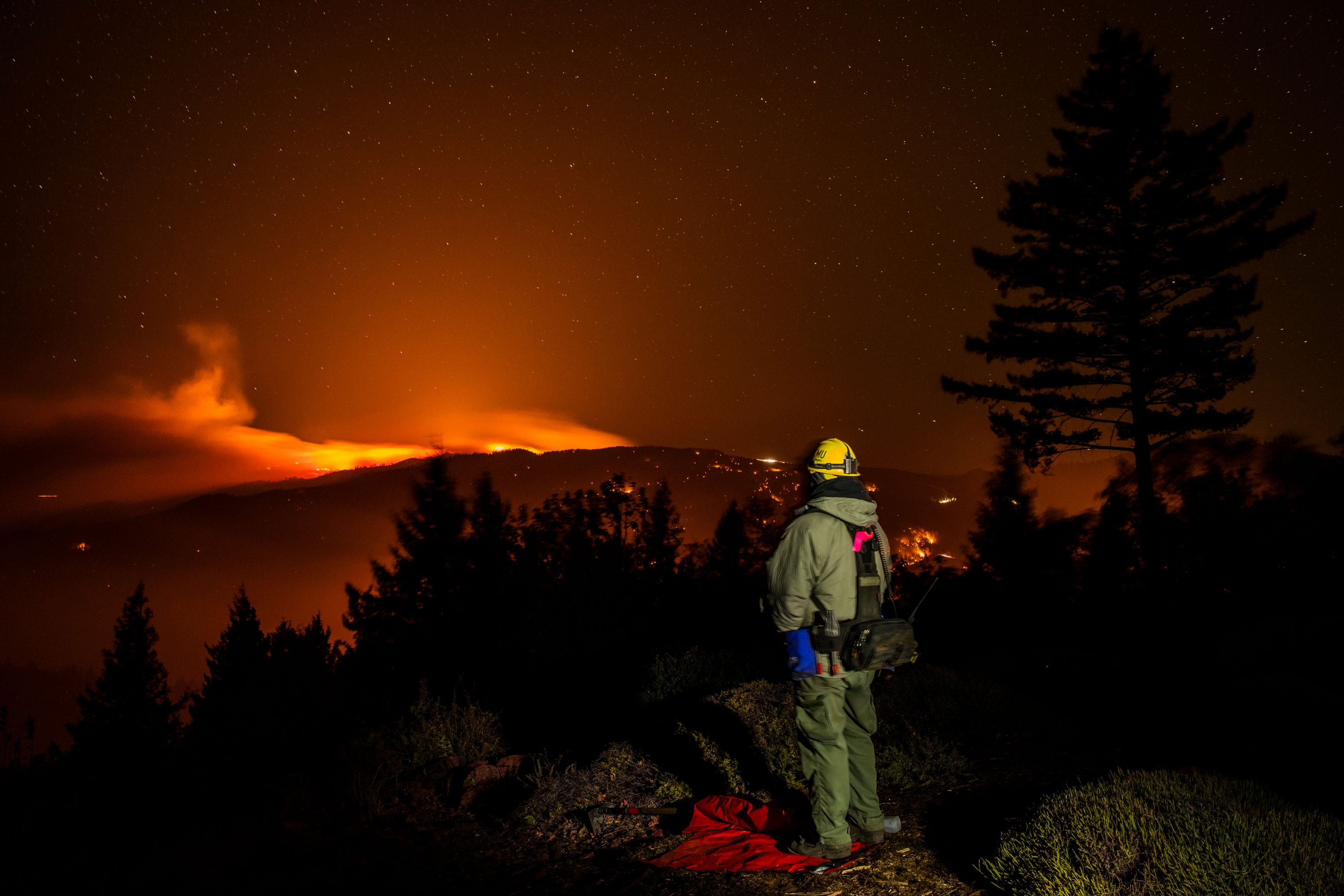 The Kincade fire burns on a ridge between Lake and Sonoma Counties on October 29, 2019. (Credit: PHILIP PACHECO/AFP via Getty Images)