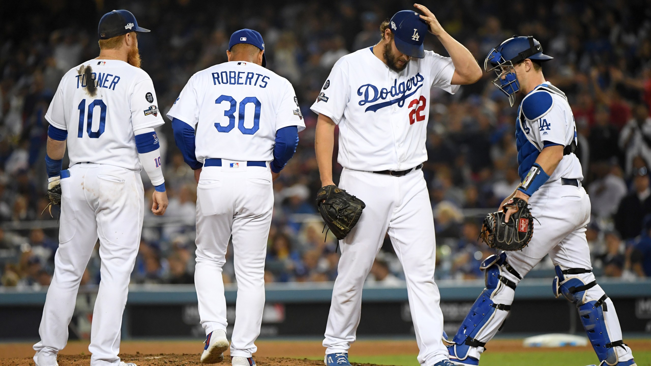 Clayton Kershaw of the Los Angeles Dodgers leaves the game after giving up back to back home runs in the eighth inning of Game 5 of the National League Division Series against the Washington Nationals at Dodger Stadium on Oct. 9, 2019. (Credit: Harry How / Getty Images)