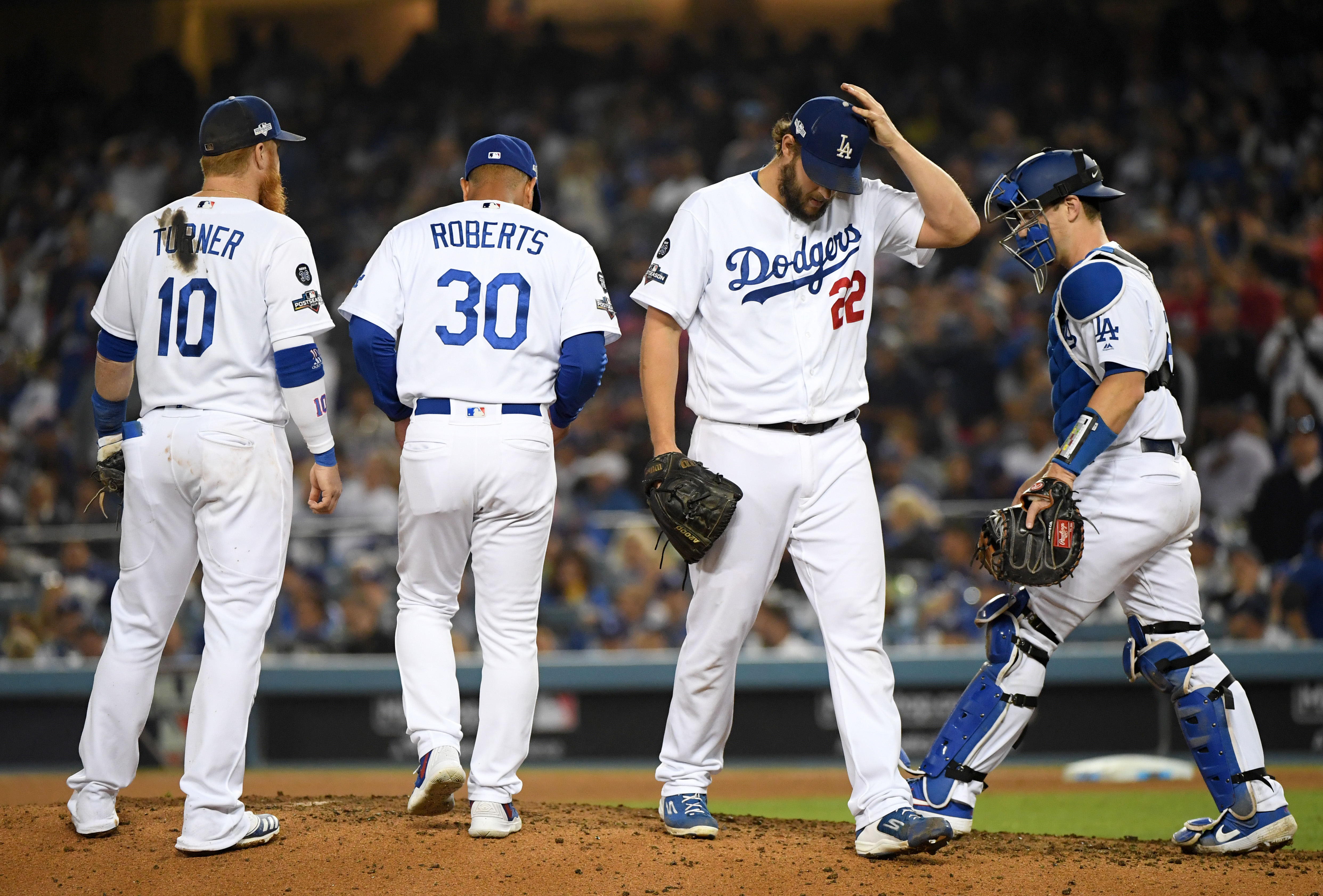 Clayton Kershaw of the Los Angeles Dodgers leaves the game after giving up back to back home runs in the eighth inning of Game 5 of the National League Division Series against the Washington Nationals at Dodger Stadium on Oct. 9, 2019. (Credit: Harry How / Getty Images)