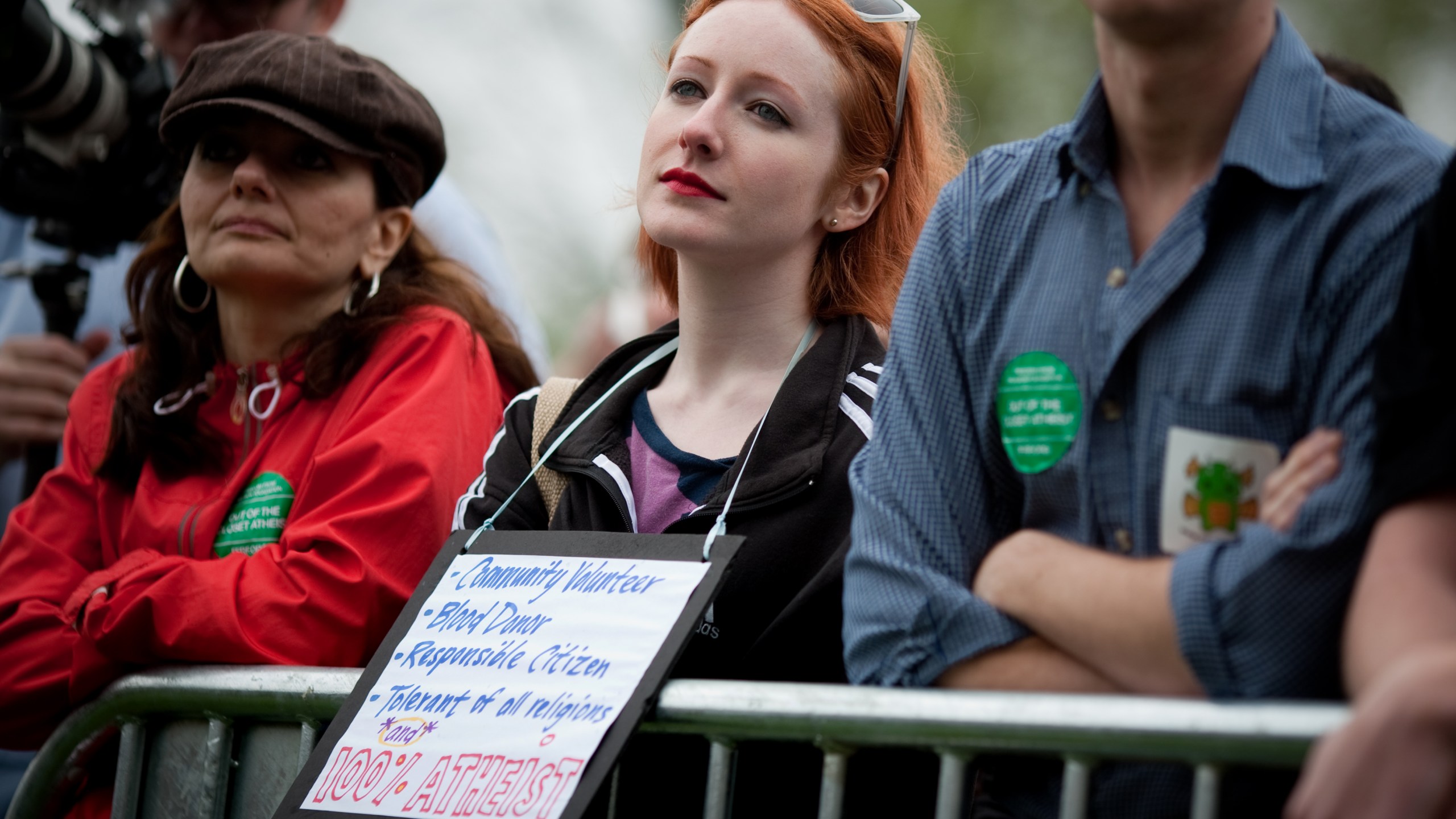 A woman listens to speakers during the National Atheist Organization's "Reason Rally" March 24, 2012 on the National Mall in Washington, D.C. (Credit: Allison Shelley/Getty Images)