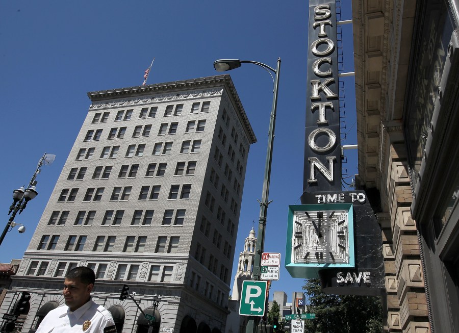 A pedestrian walks by the vacant Bank of Stockton on June 27, 2012 in Stockton. (Credit: Justin Sullivan/Getty Images)