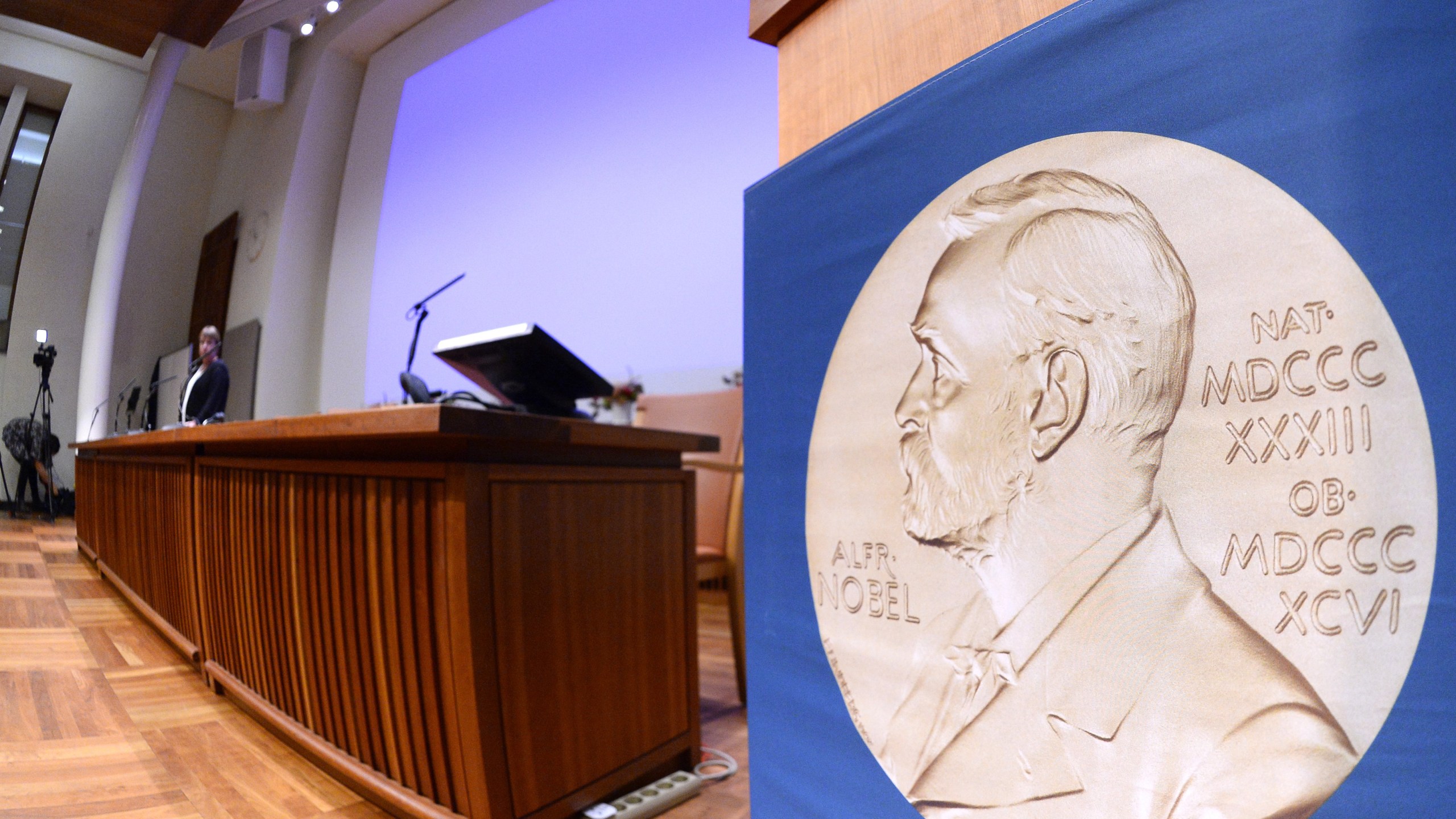 The laureate medal featuring the portrait of Alfred Nobel is seen on a sign before the Nobel Committee announced the 2015 winners on Oct. 5, 2015, in Stockholm, Sweden.(Credit: Jonathan Nackstrand/AFP/Getty Images)