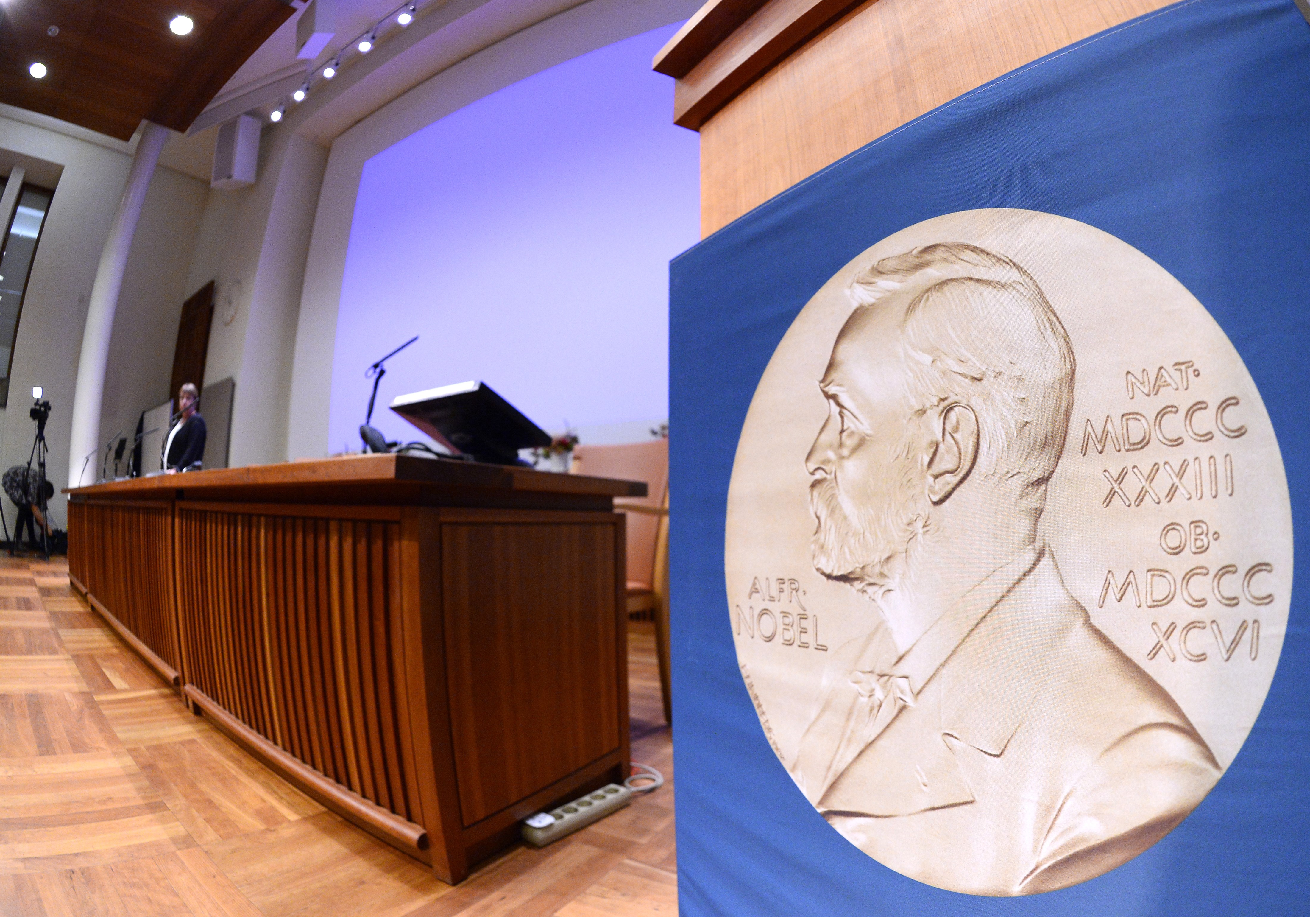 The laureate medal featuring the portrait of Alfred Nobel is seen on a sign before the Nobel Committee announced the 2015 winners on Oct. 5, 2015, in Stockholm, Sweden.(Credit: Jonathan Nackstrand/AFP/Getty Images)