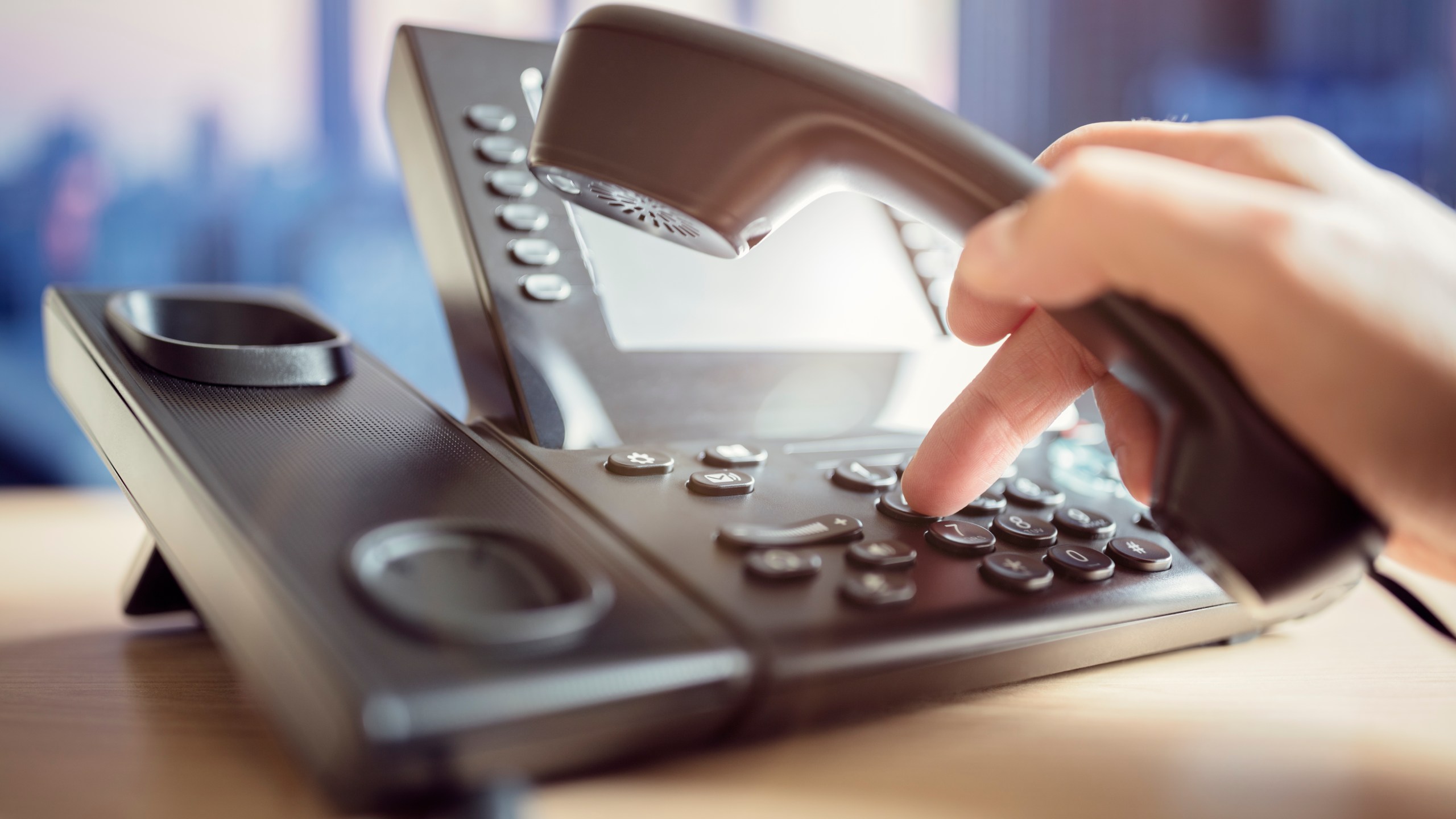 Someone is seen dialing to make a telephone call in this file photo. (Credit: iStock / Getty Images Plus)