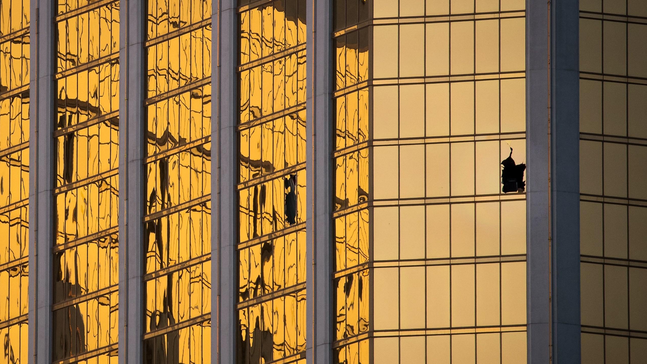 A window is broken on the 32nd floor of the Mandalay Bay Resort and Casino where a gunman opened fire on a concert crowd on Sunday night, October 3, 2017 in Las Vegas, Nevada. (Credit: Drew Angerer/Getty Images)