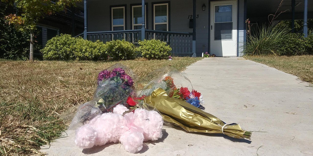 Flowers are laid out in front of Atatiana Jefferson's home on Oct. 13., 2019, after the 28-year-old was shot and killed by a white police officer in Fort Worth. (Credit: CNN)