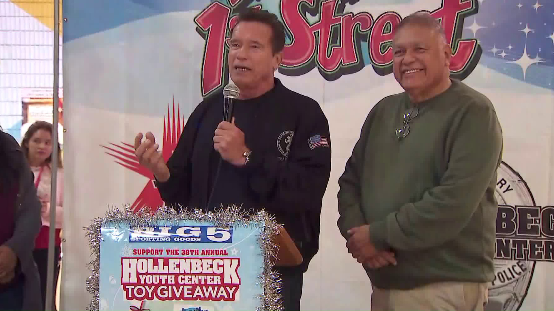 Former Gov. Arnold Schwarzenegger helps give away turkeys and food baskets to Boyle Heights residents as part of the Miracle on First Street holiday program on Nov. 25, 2019. (Credit: KTLA)