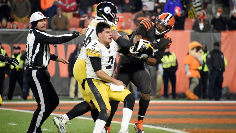 Quarterback Mason Rudolph of the Pittsburgh Steelers fights with defensive end Myles Garrett of the Cleveland Browns during the second half at FirstEnergy Stadium on Nov. 14, 2019 in Cleveland, Ohio. (Credit: Jason Miller/Getty Images)