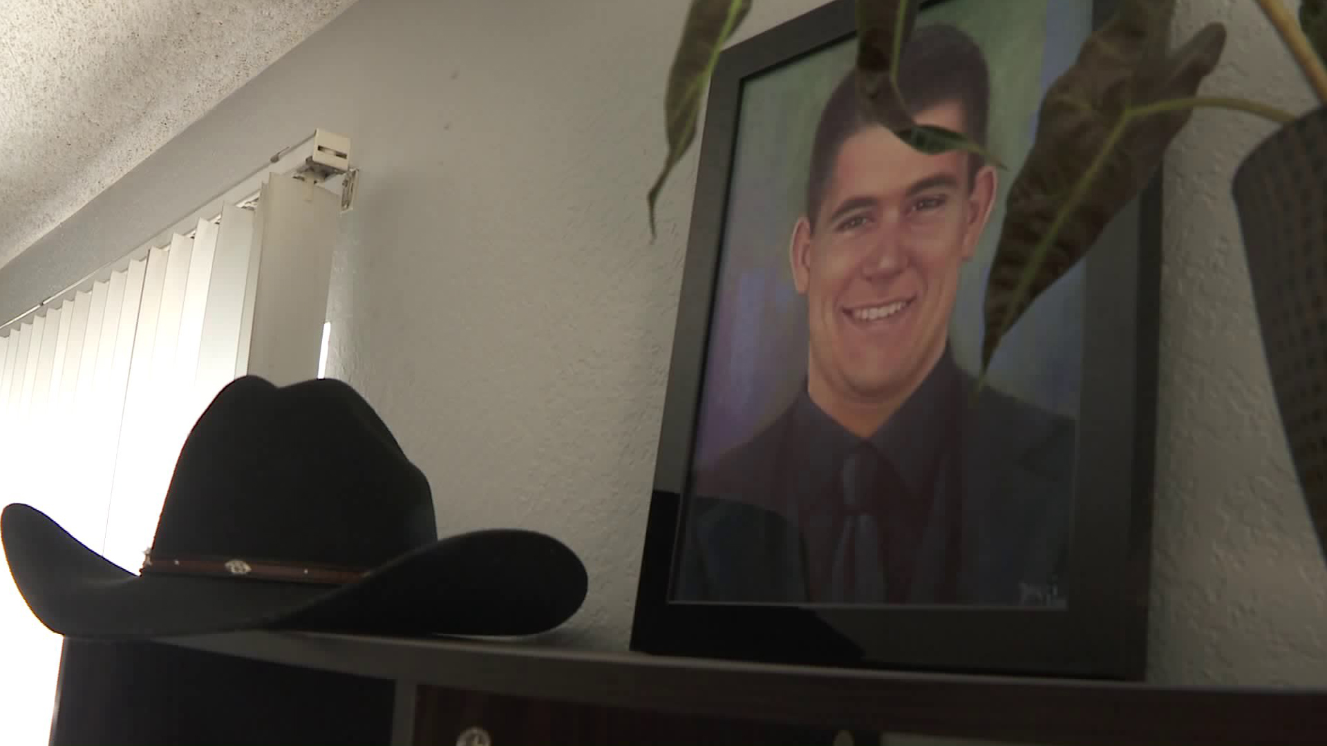 Cody Coffman appears in a photo displayed in his family's living room a year after he died in the 2018 Borderline Bar & Grill mass shooting in Thousand Oaks. (Credit: KTLA)