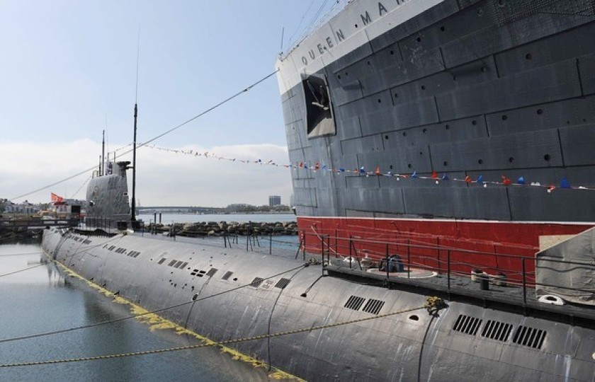 The Russian Foxtrot-Class submarine known as the Scorpion sits next to the Queen Mary in this undated photo.(Credit: Wally Skalij / Los Angeles Times)