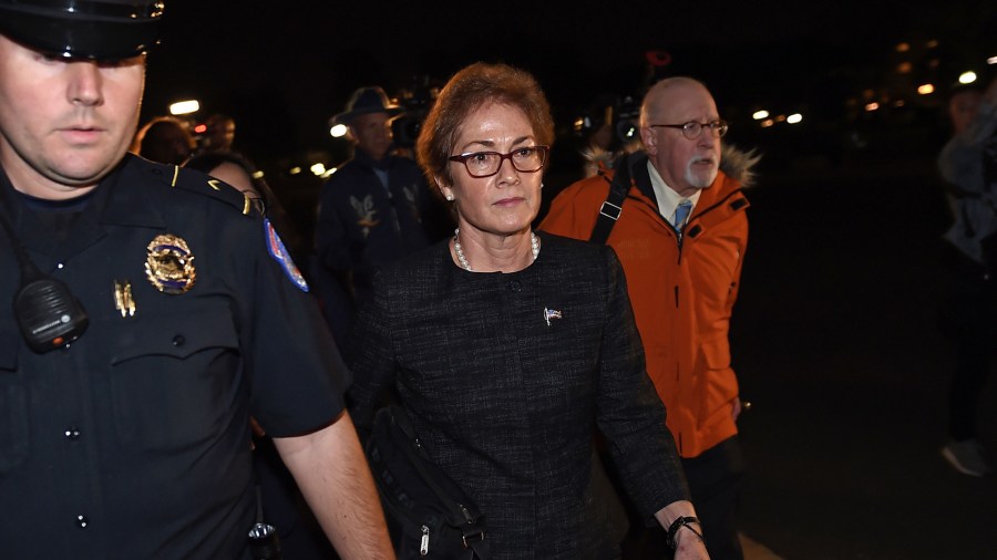 Former US Ambassador to Ukraine Marie Yovanovitch (C) flanked by lawyers, aides and Capitol police, leaves the US Capitol October 11, 2019 in Washington, DC after testifying behind closed doors to the House Intelligence, Foreign Affairs and Oversight committees as part of the ongoing impeachment investigation against President Donald Trump. (Credit: Olivier Douliery/AFP/Getty Images)