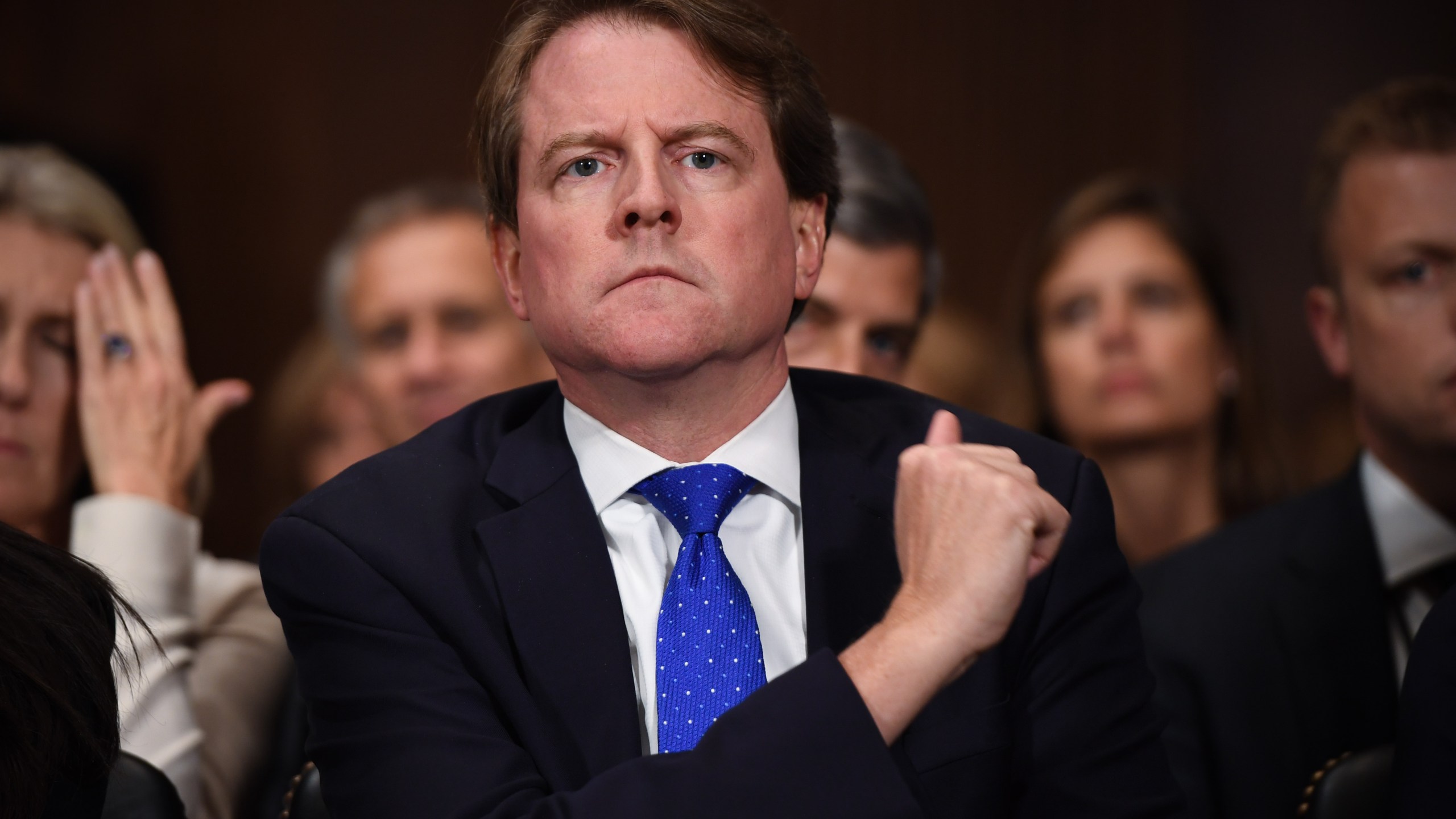 White House Counsel and Assistant to the President for U.S. President Donald Trump, Donald McGahn, listens to Supreme Court nominee Brett Kavanaugh as he testifies before the US Senate Judiciary Committee on Capitol Hill in Washington, DC, September 27, 2018. (Credit: SAUL LOEB/AFP via Getty Images)