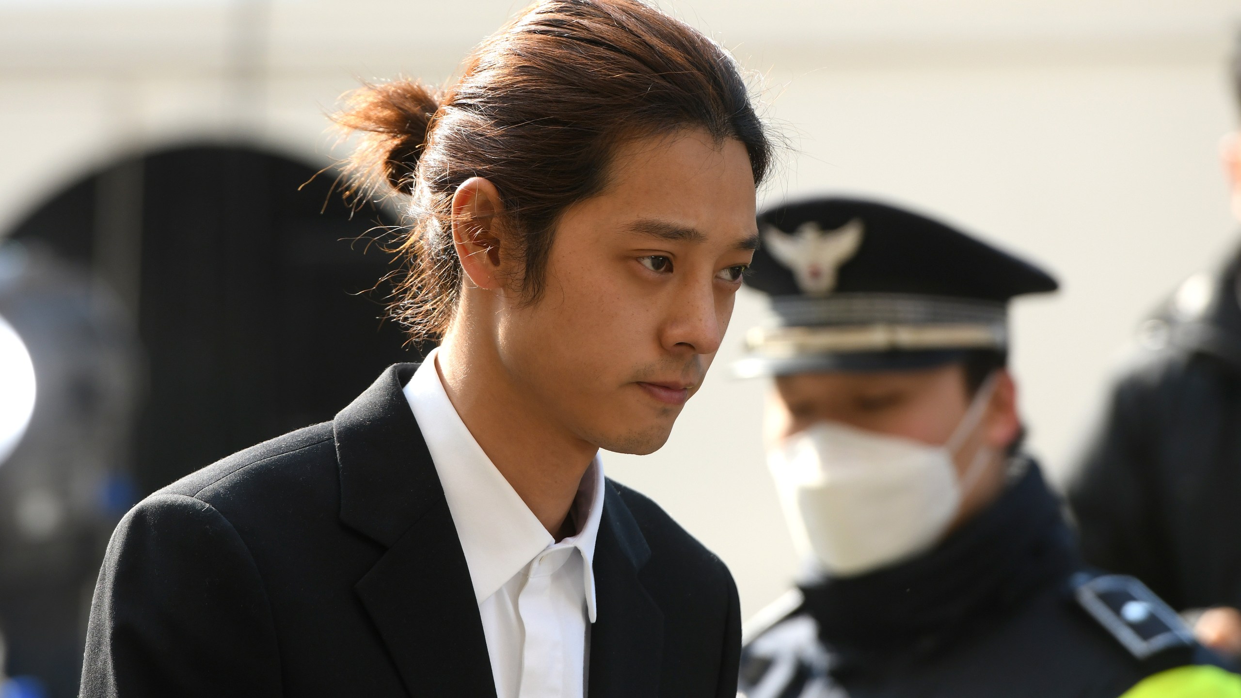 K-pop star Jung Joon-young arrives for questioning at the Seoul Metropolitan Police Agency in Seoul, South Korea on March 14, 2019. (Credit: JUNG YEON-JE/AFP via Getty Images)