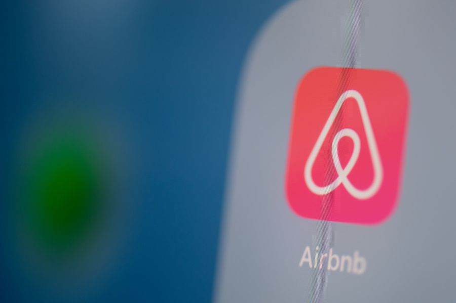 This illustration picture taken on July 24, 2019, in Paris, shows the logo of the U.S. online booking platform Airbnb on the screen of a tablet. (Credit: MARTIN BUREAU/AFP via Getty Images)