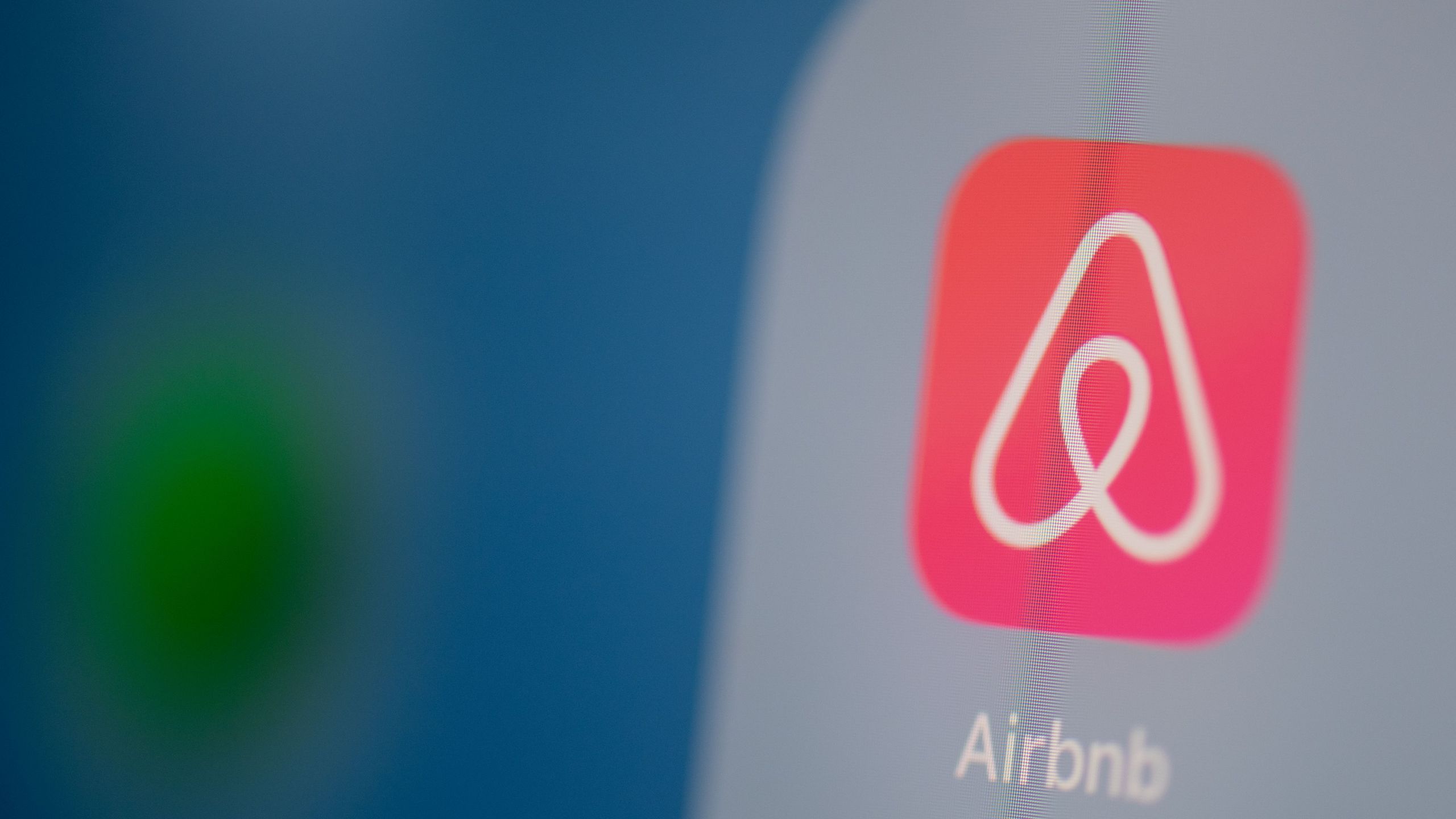 This illustration picture taken on July 24, 2019, in Paris shows the Airbnb logo on the screen of a tablet. (MARTIN BUREAU/AFP via Getty Images)