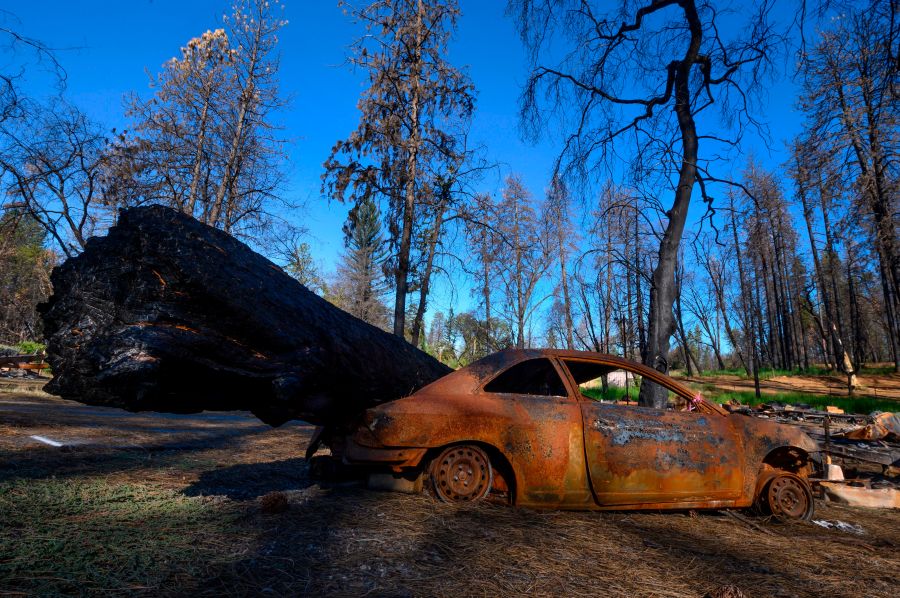 Debris still scattered across a mobile home park almost one year after the Camp Fire destroyed the residential park, is seen on Oct. 2, 2019 in Paradise, California. (Credit: Robyn Beck/AFP via Getty Images)