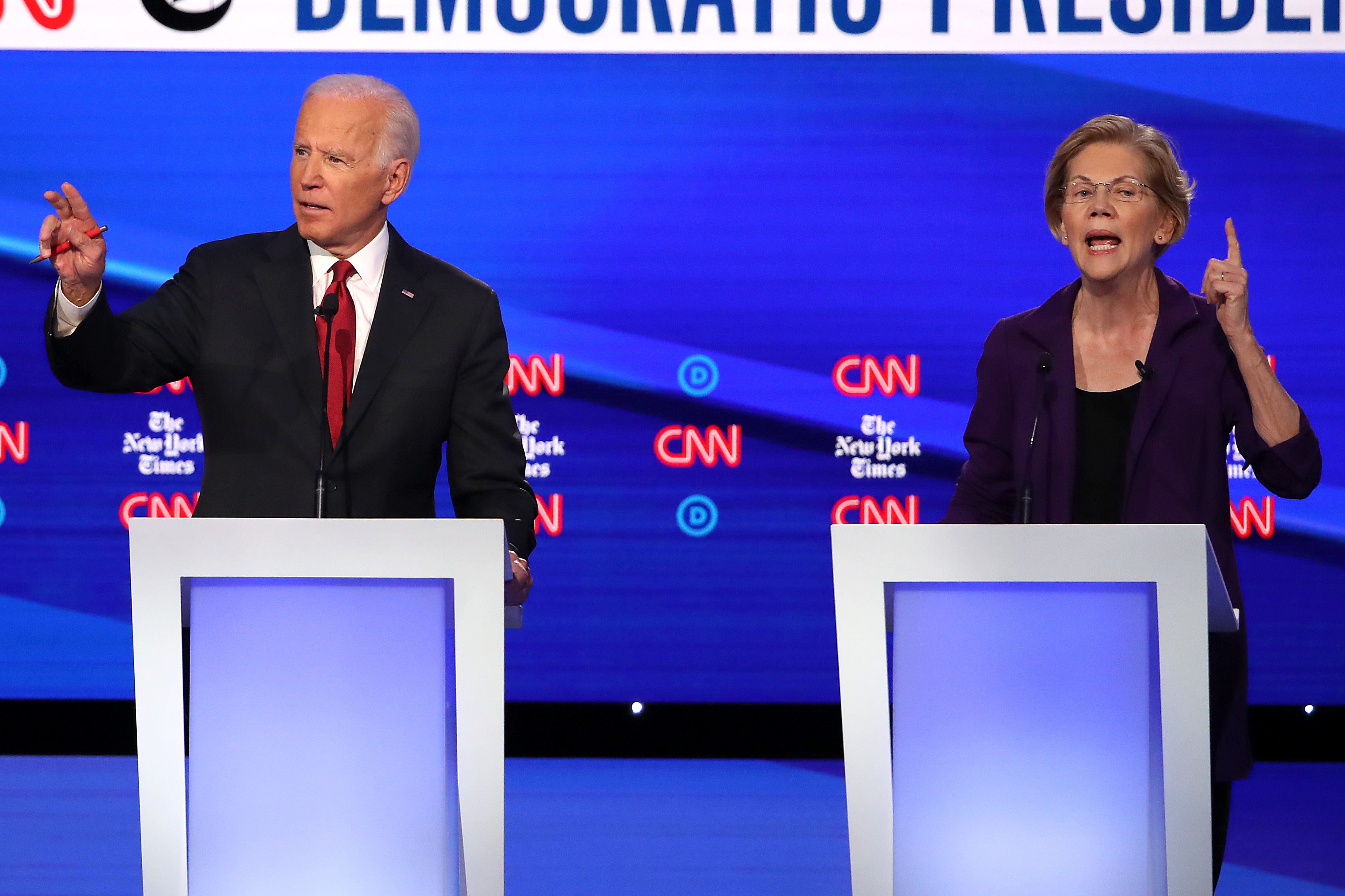 Former Vice President Joe Biden and Sen. Elizabeth Warren (D-MA) react during the Democratic Presidential Debate at Otterbein University on Oct. 15, 2019, in Westerville, Ohio. (Credit: Win McNamee/Getty Images)