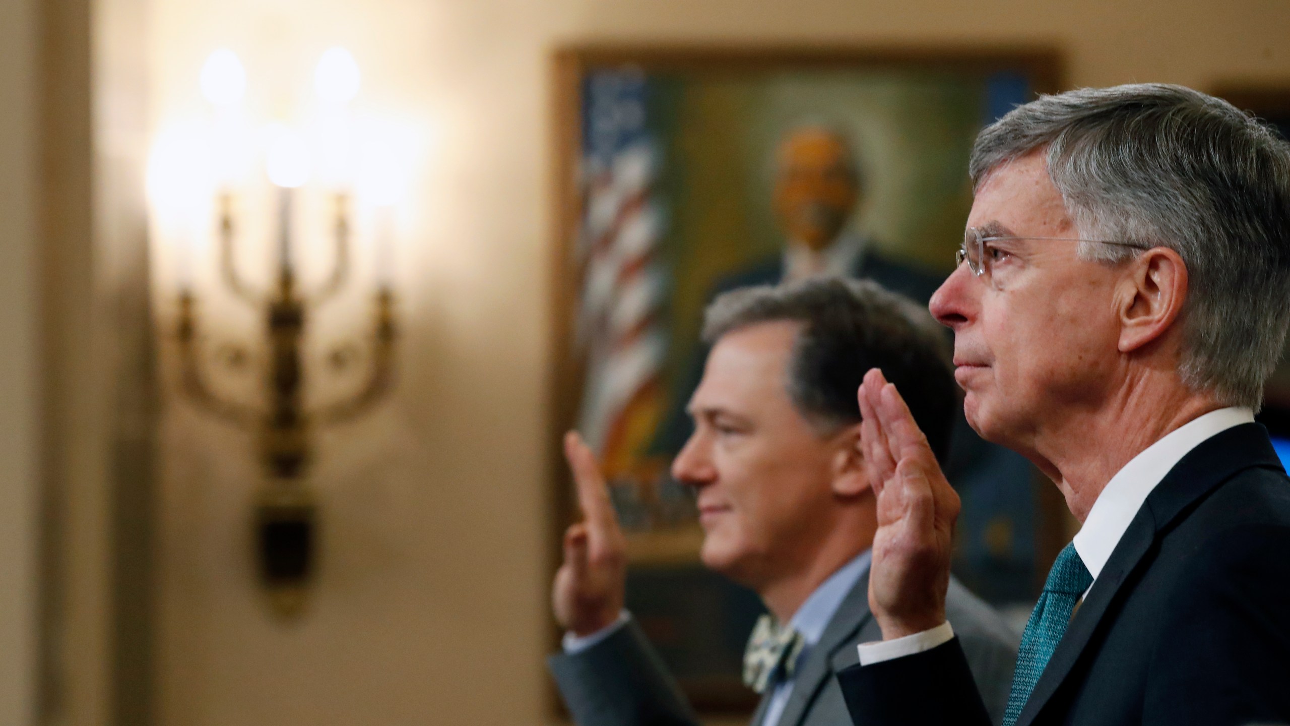 From right: Top U.S. diplomat to Ukraine, William B. Taylor Jr. and Deputy Assistant Secretary for European and Eurasian Affairs George P. Kent are sworn in to testify before the House Permanent Select Committee on Intelligence hearing on the impeachment inquiry into US President Donald J. Trump, on Capitol Hill on Nov. 13, 2019 in Washington, D.C. (Credit: Alex Brandon-Pool/Getty Images)