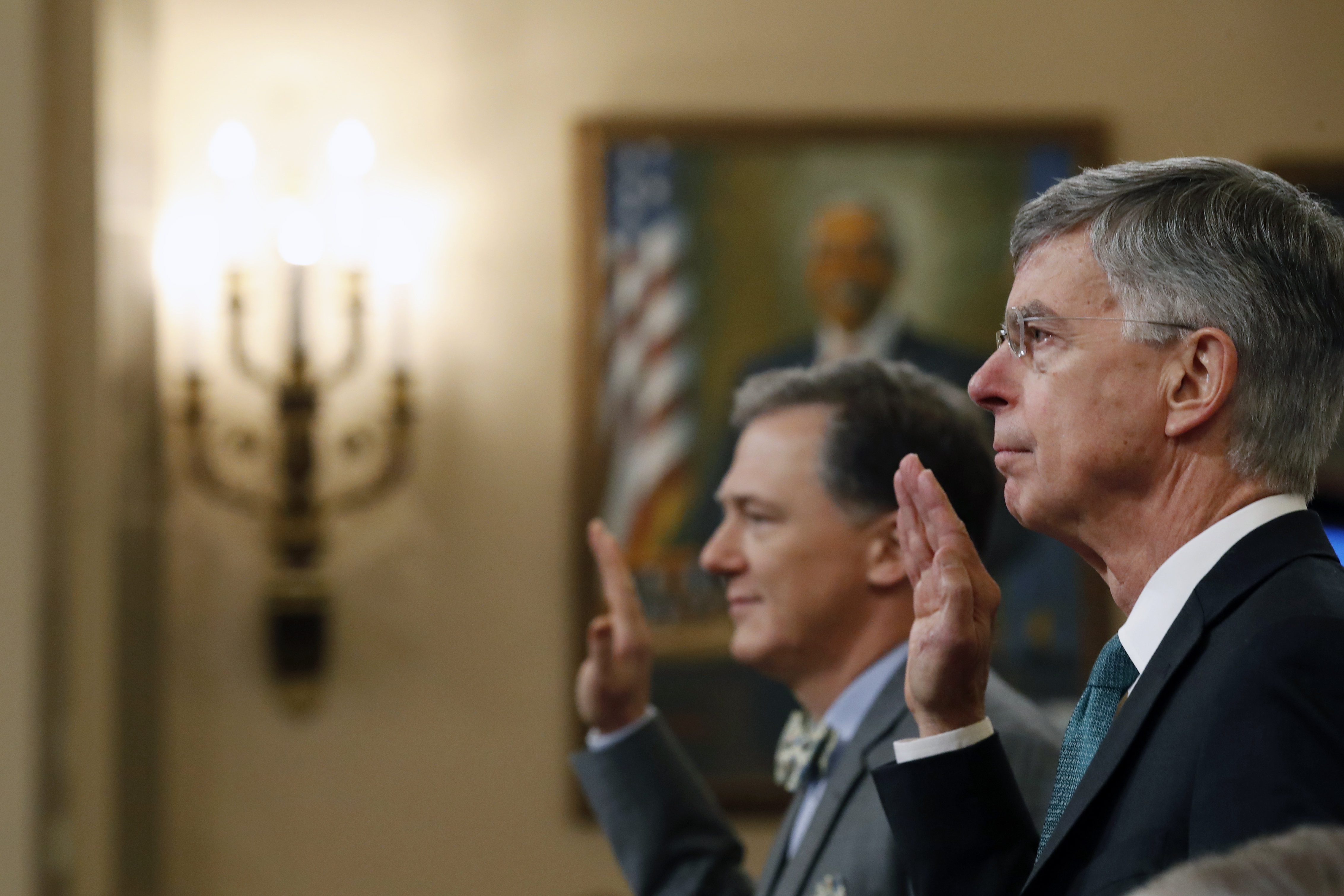 From right: Top U.S. diplomat to Ukraine, William B. Taylor Jr. and Deputy Assistant Secretary for European and Eurasian Affairs George P. Kent are sworn in to testify before the House Permanent Select Committee on Intelligence hearing on the impeachment inquiry into US President Donald J. Trump, on Capitol Hill on Nov. 13, 2019 in Washington, D.C. (Credit: Alex Brandon-Pool/Getty Images)