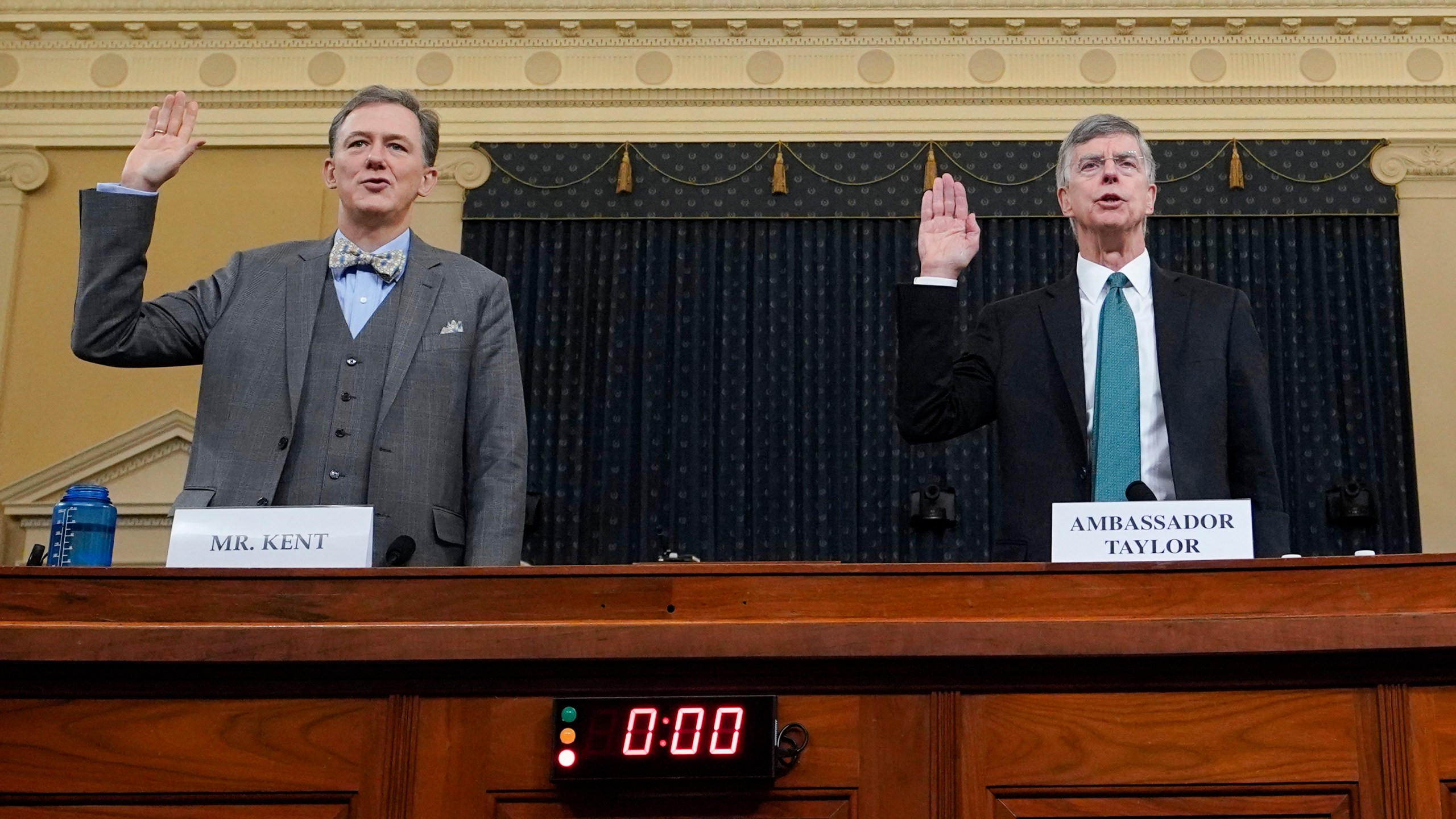 Deputy Assistant Secretary for European and Eurasian Affairs George P. Kent and top U.S. diplomat in Ukraine William B. Taylor Jr. are sworn-in prior to testifying before the House Intelligence Committee on Capitol Hill November 13, 2019 in Washington, DC. (Credit: Joshua Roberts - Pool/Getty Images)