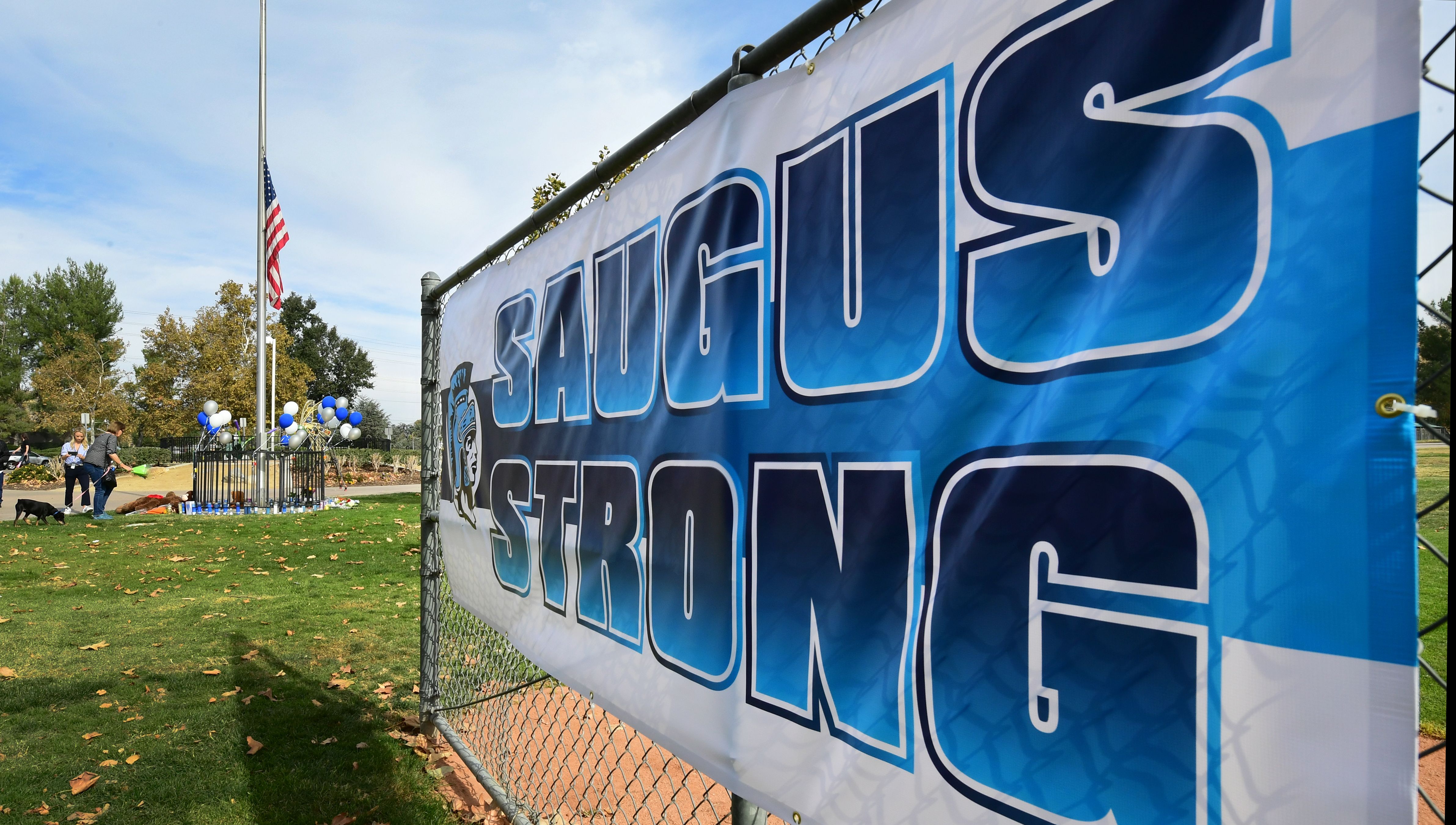 A sign reads "Saugus Strong" at a makeshift memorial in Central Park, near Saugus High School, Nov. 15, 2019 in Santa Clarita. (Credit: FREDERIC J. BROWN/AFP via Getty Images)