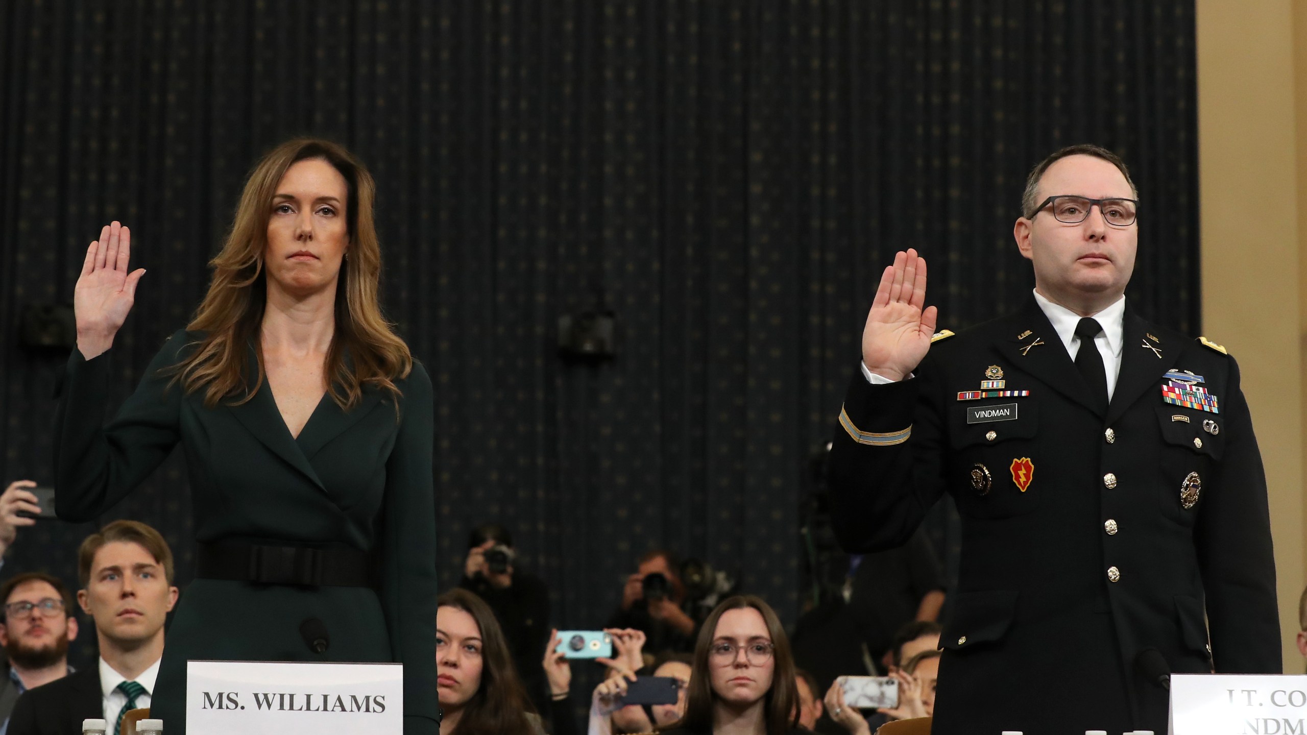 Jennifer Williams, adviser to Vice President Mike Pence for European and Russian affairs, and National Security Council Director for European Affairs Lt. Col. Alexander Vindman are sworn in to testify before the House Intelligence Committee in the Longworth House Office Building on Capitol Hill November 19, 2019. (Credit: Chip Somodevilla/Getty Images)