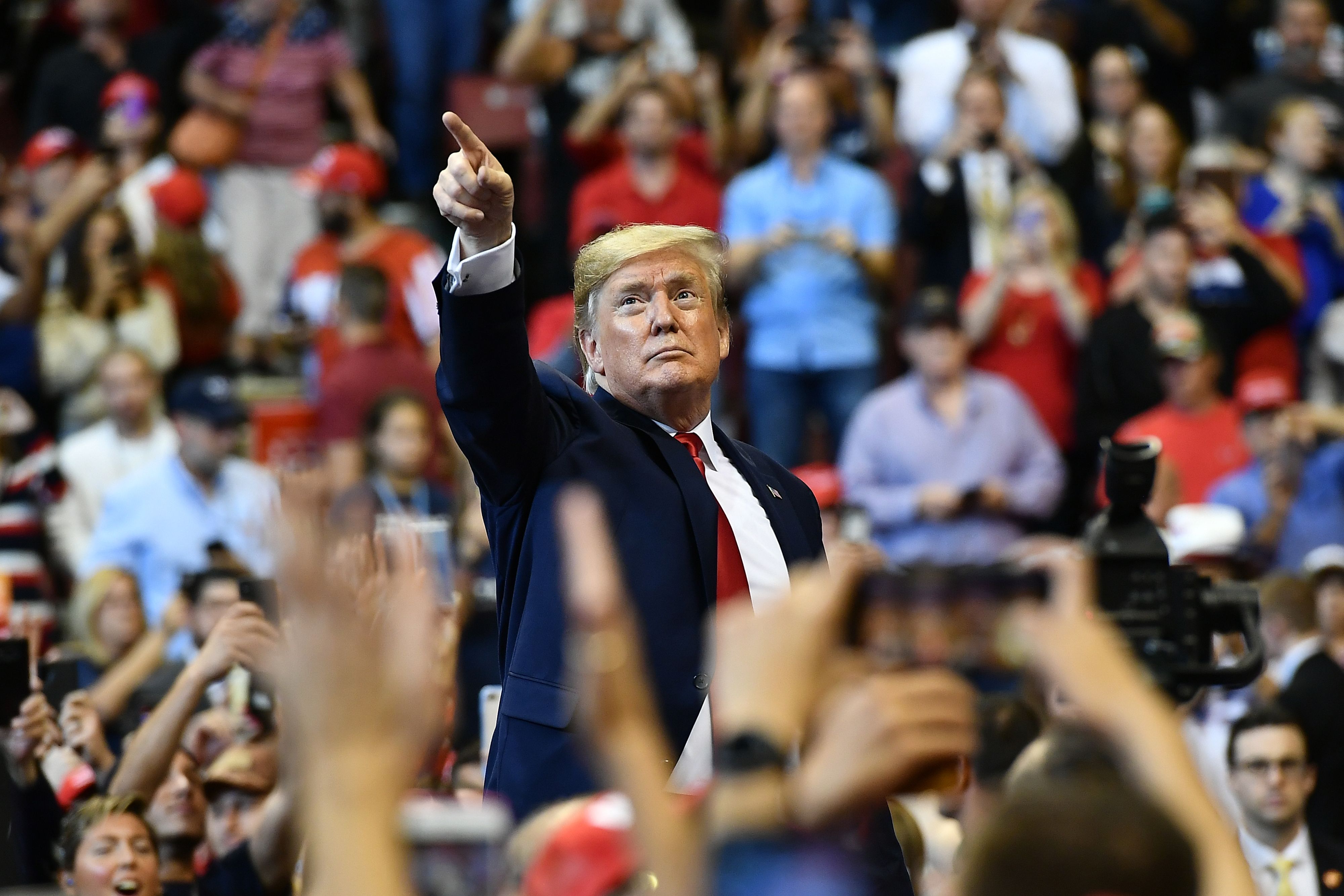 President Donald Trump points with his finger to supporters during a campaign rally in Sunrise, Florida, on Nov. 26, 2019. (Credit: Mandel Ngan / AFP / Getty Images)