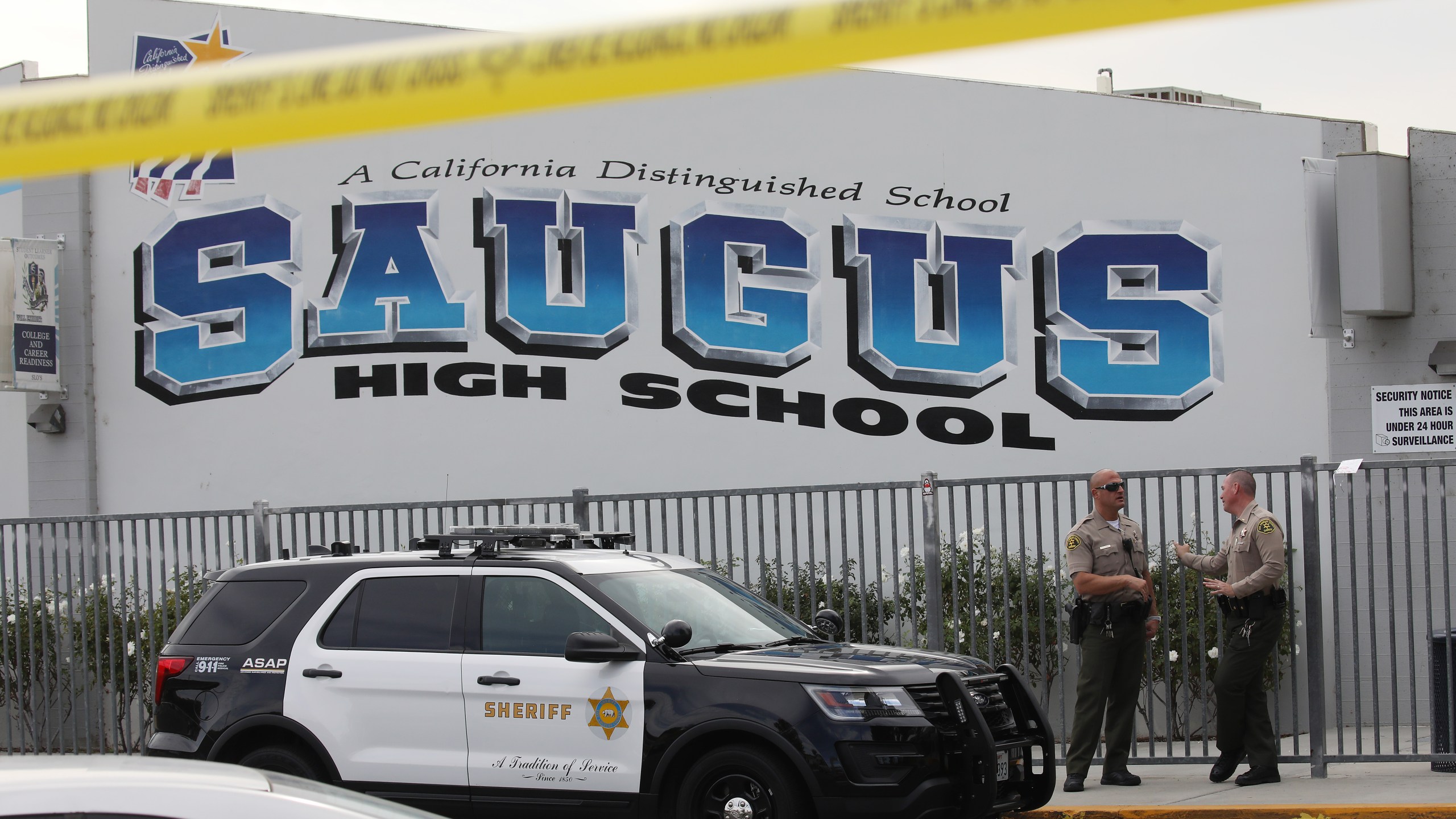 L.A. County sheriff's deputies are positioned at Saugus High School in Santa Clarita on Nov. 15, 2019, a day after a deadly shooting there. (Credit: Mario Tama/Getty Images)