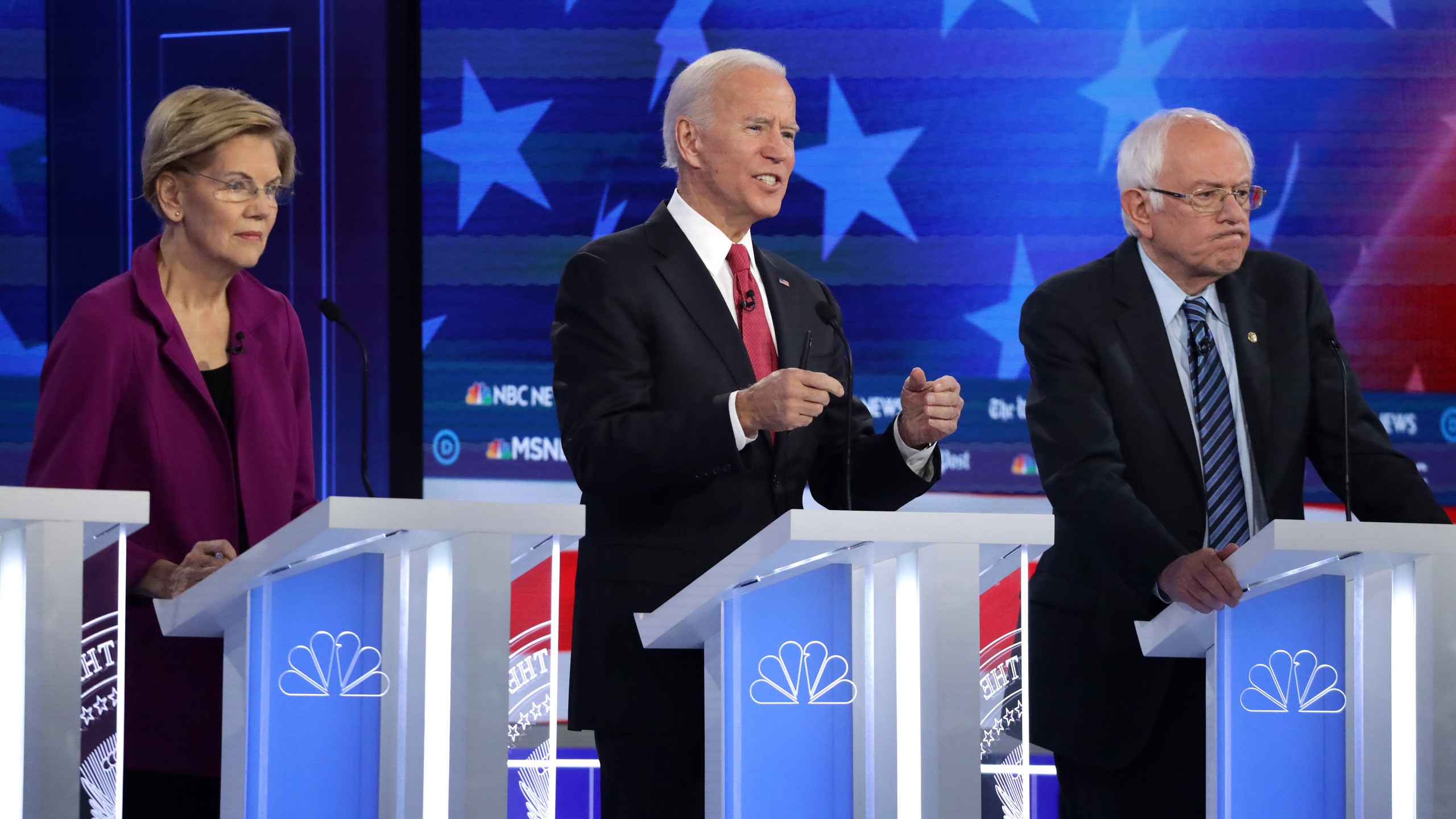 Sen. Elizabeth Warren (D-MA) (L), former Vice President Joe Biden and Sen. Bernie Sanders (I-VT) (R) participate in the Democratic Presidential Debate at Tyler Perry Studios November 20, 2019 in Atlanta, Georgia. (Credit: Alex Wong/Getty Images)