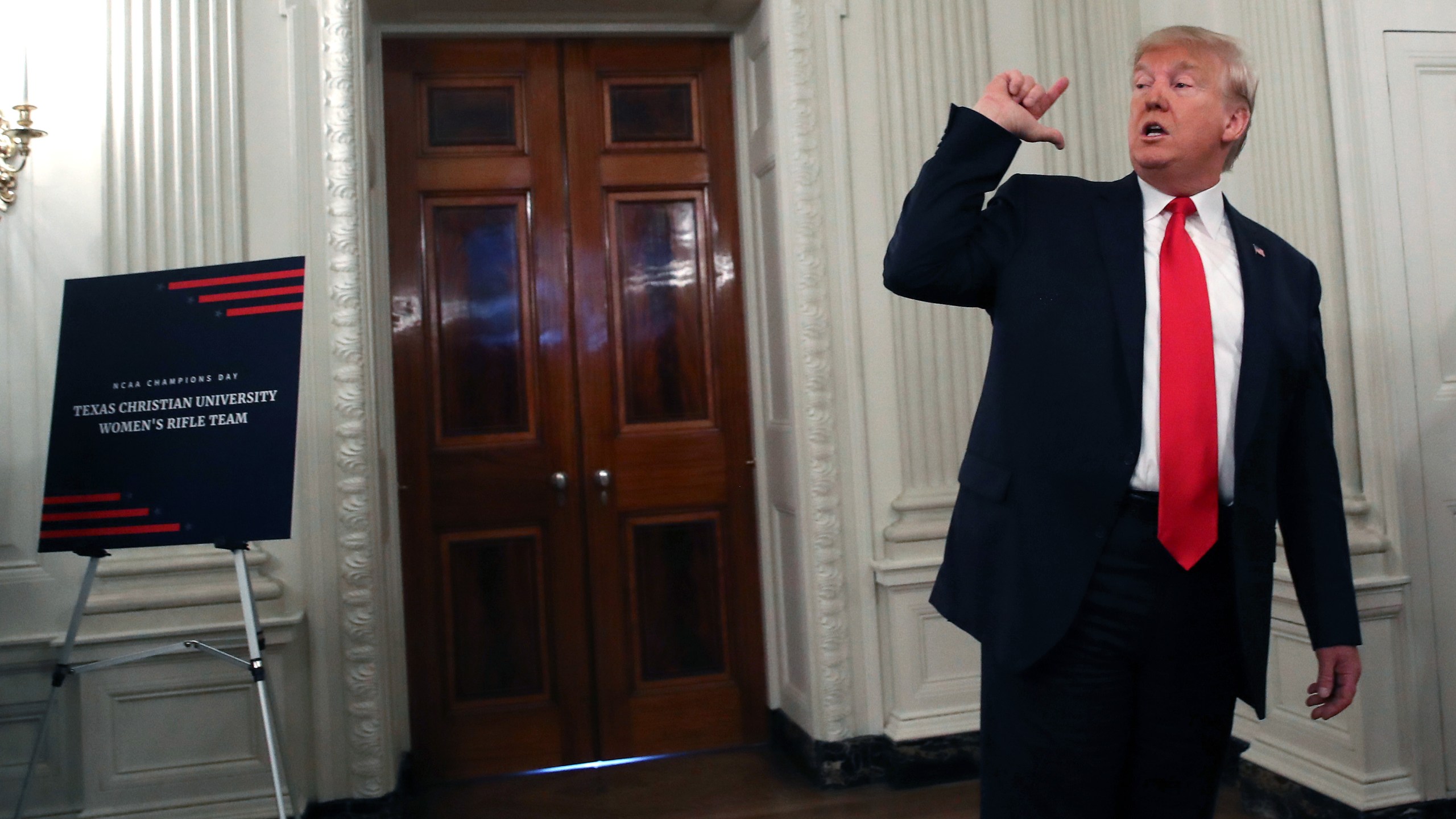 U.S. President Donald Trump briefly speaks to the media after greeting sports teams in the State Dining Room during the NCAA Collegiate National Champions Day on Nov. 22, 2019. (Credit: Mark Wilson/Getty Images)