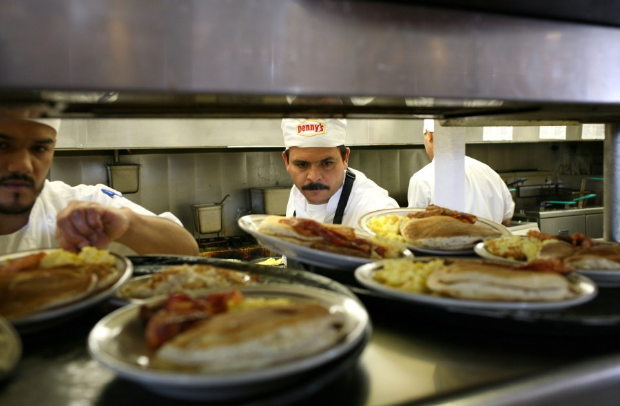 Denny's cooks prepare free Grand Slam breakfast plates February 3, 2009 in Emeryville, California. (Credit: Justin Sullivan/Getty Images)