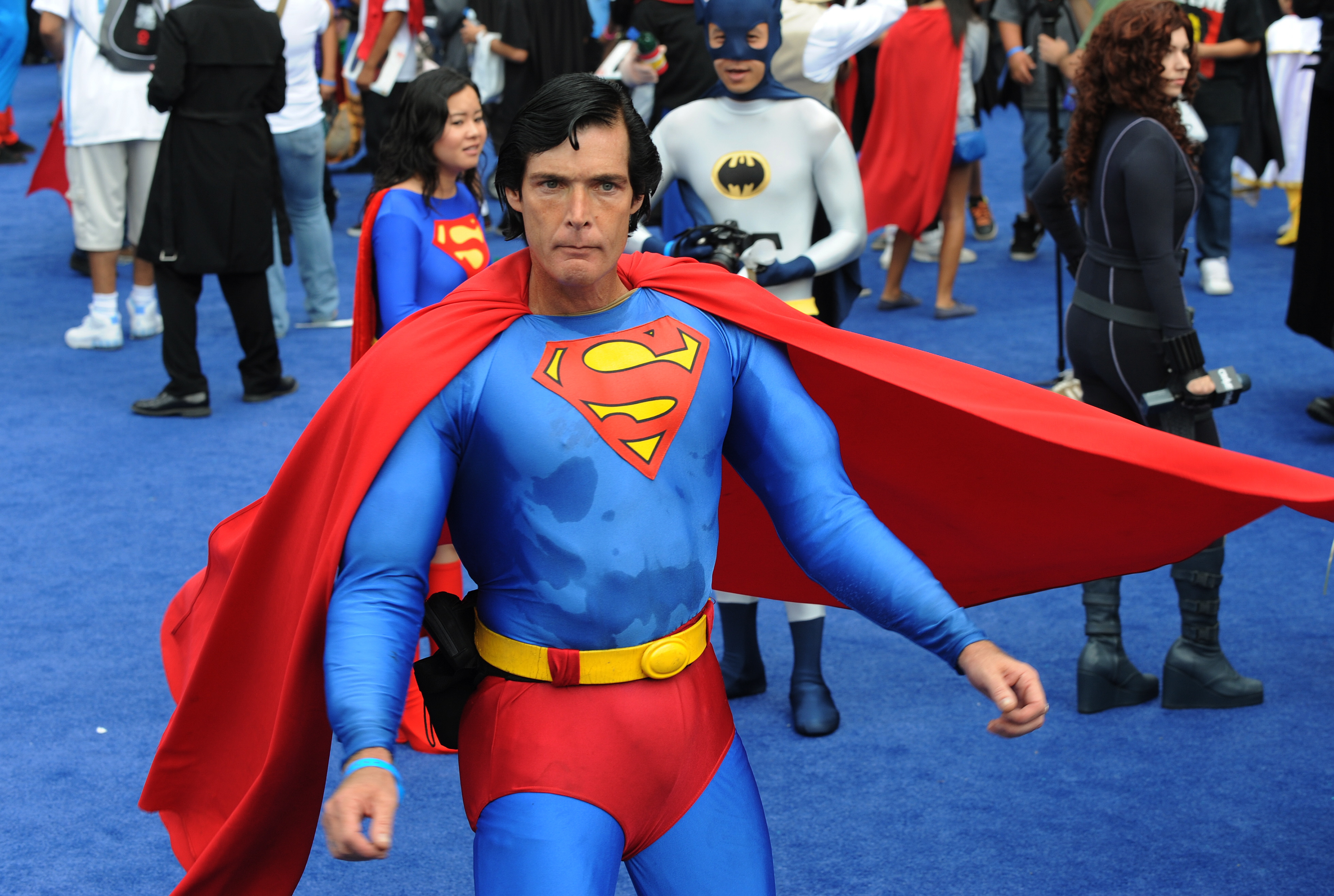 Christopher Dennis dressed as Superman joins the crowd of 1,580 costumed superheroes during the successful attempt to break the Guinness World Record for the largest gathering of superheroes outside the Staples Center in Los Angeles on Oct. 2, 2010. (Credit: Mark Ralston / AFP / Getty Images)