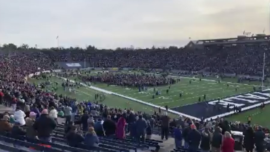 Protestors stormed the field at halftime of the Harvard and Yale football game in New Haven, Connecticut on Nov. 23, 2019. (Credit: CNN)