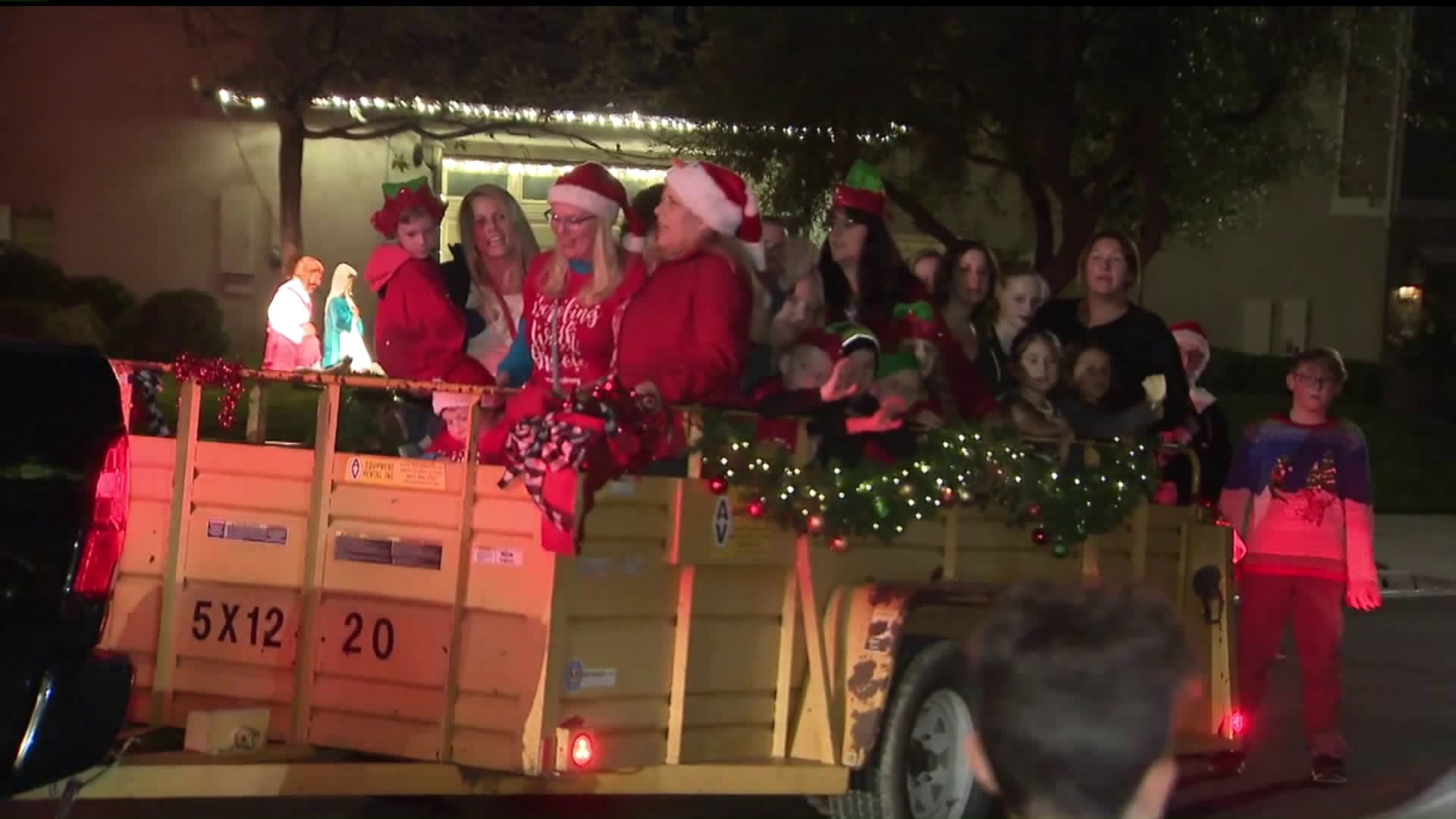 Loved ones of Saugus High School shooting victim Gracie Anne Muehlberger gather to sing Christmas carols and collect food for the needy in her honor in Saugus on Dec. 12, 2019. (Credit: KTLA)