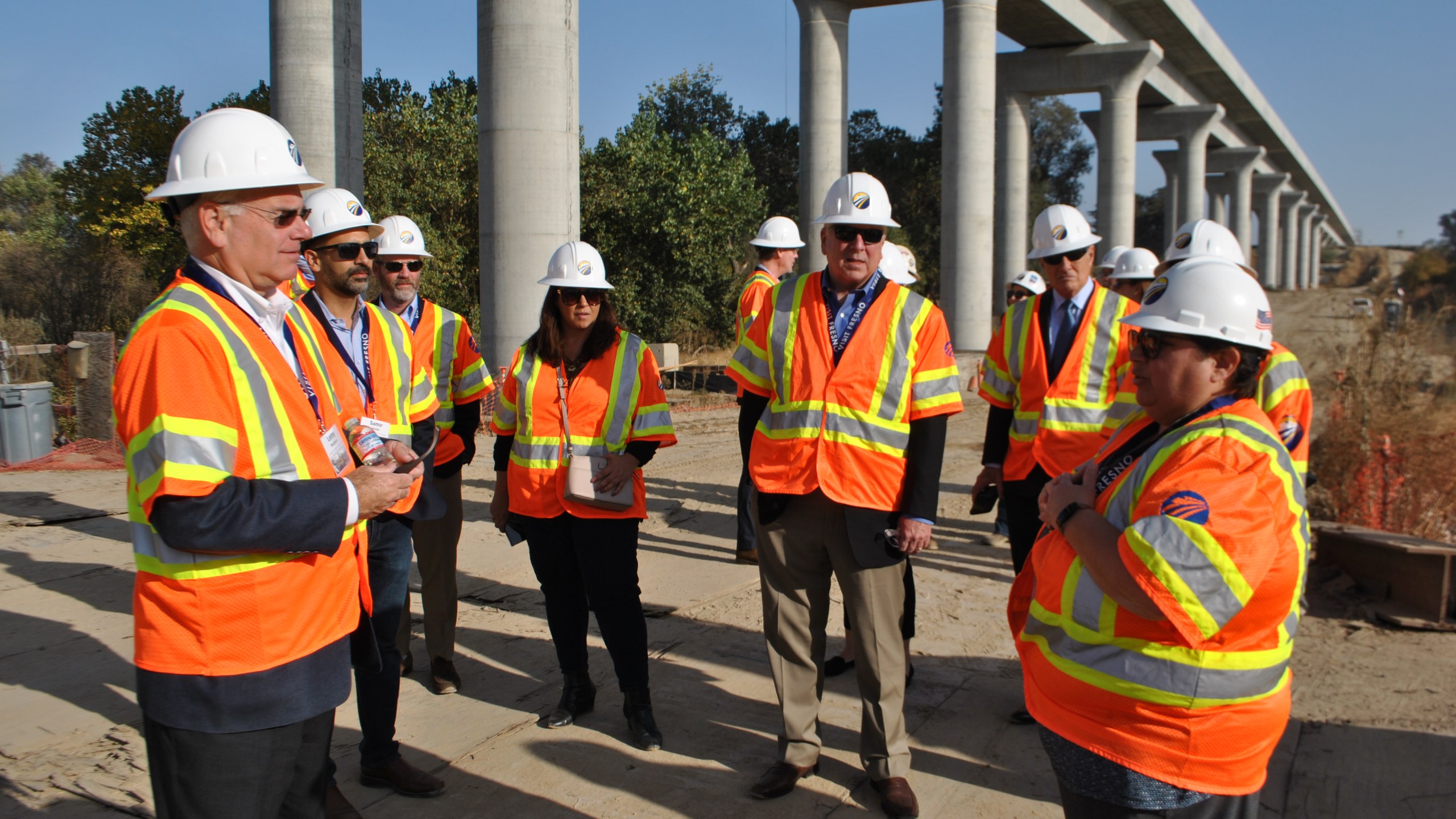 Officials lead a tour of several construction sites on California's high-speed rail project in Fresno on Nov. 6, 2019. (Credit: California High-Speed Rail Authority)