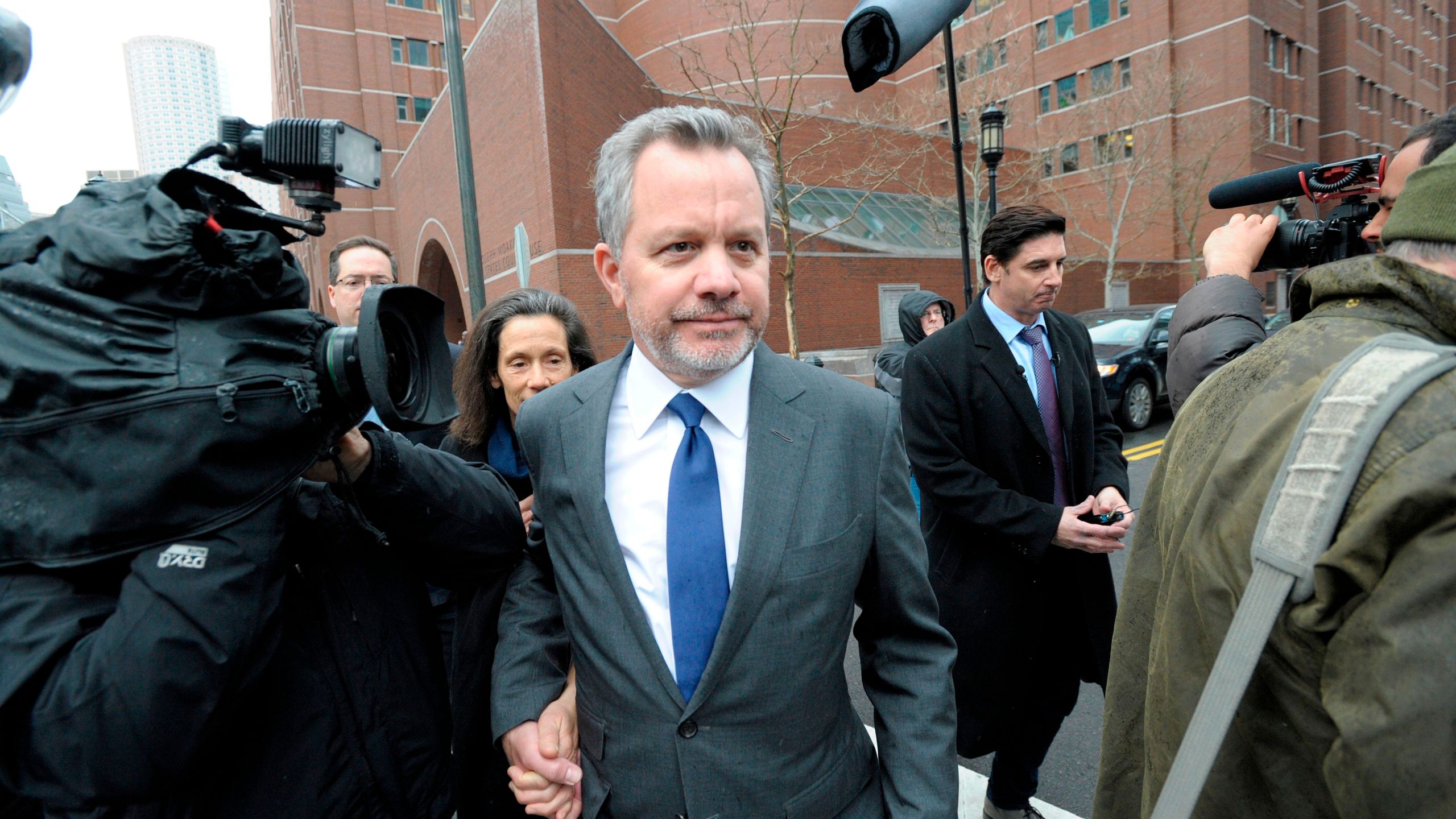 William McGlashan, Jr. makes his way out of the courthouse after making his plea in front of a judge for charges in the college admissions scandal at the John Joseph Moakley U.S. Courthouse in March 2019. (JOSEPH PREZIOSO/AFP via Getty Images)