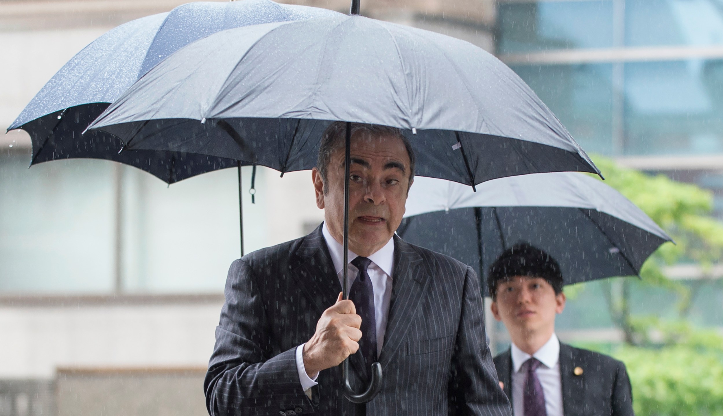 Former Nissan Motor Chairman Carlos Ghosn arrives for a pre-trial hearing at the Tokyo District Court in Tokyo on June 24, 2019. (Credit: KAZUHIRO NOGI/AFP via Getty Images)