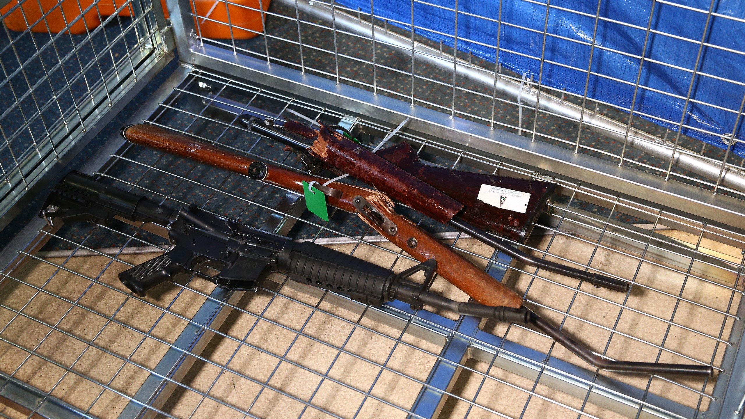 Destroyed guns lie in a container during a firearm buyback collection event on July 4, 2019 in Wellington, New Zealand. (Credit: Hagen Hopkins/Getty Images)