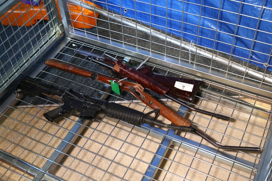 Destroyed guns lie in a container during a firearm buyback collection event on July 4, 2019 in Wellington, New Zealand. (Credit: Hagen Hopkins/Getty Images)