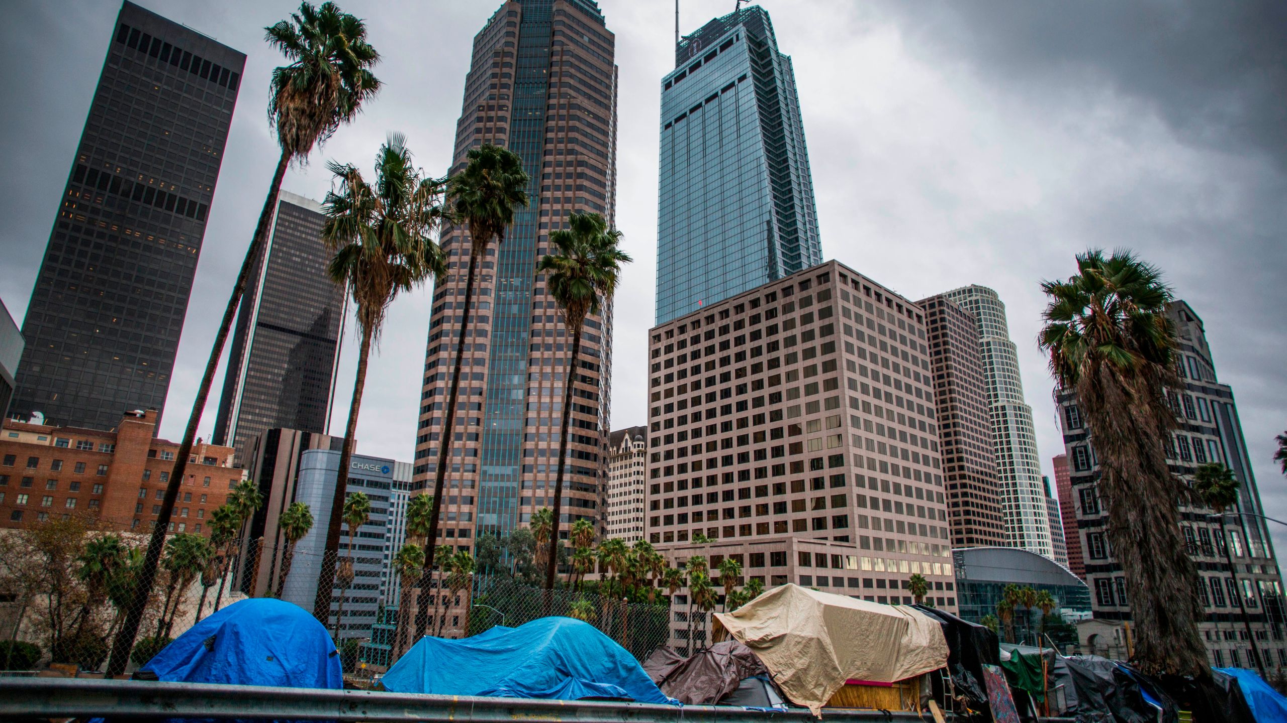 Tents line a freeway ramp in downtown Los Angeles on Thanksgiving Day, Nov. 28, 2019. (Credit: Apu Gomes / AFP / Getty Images)