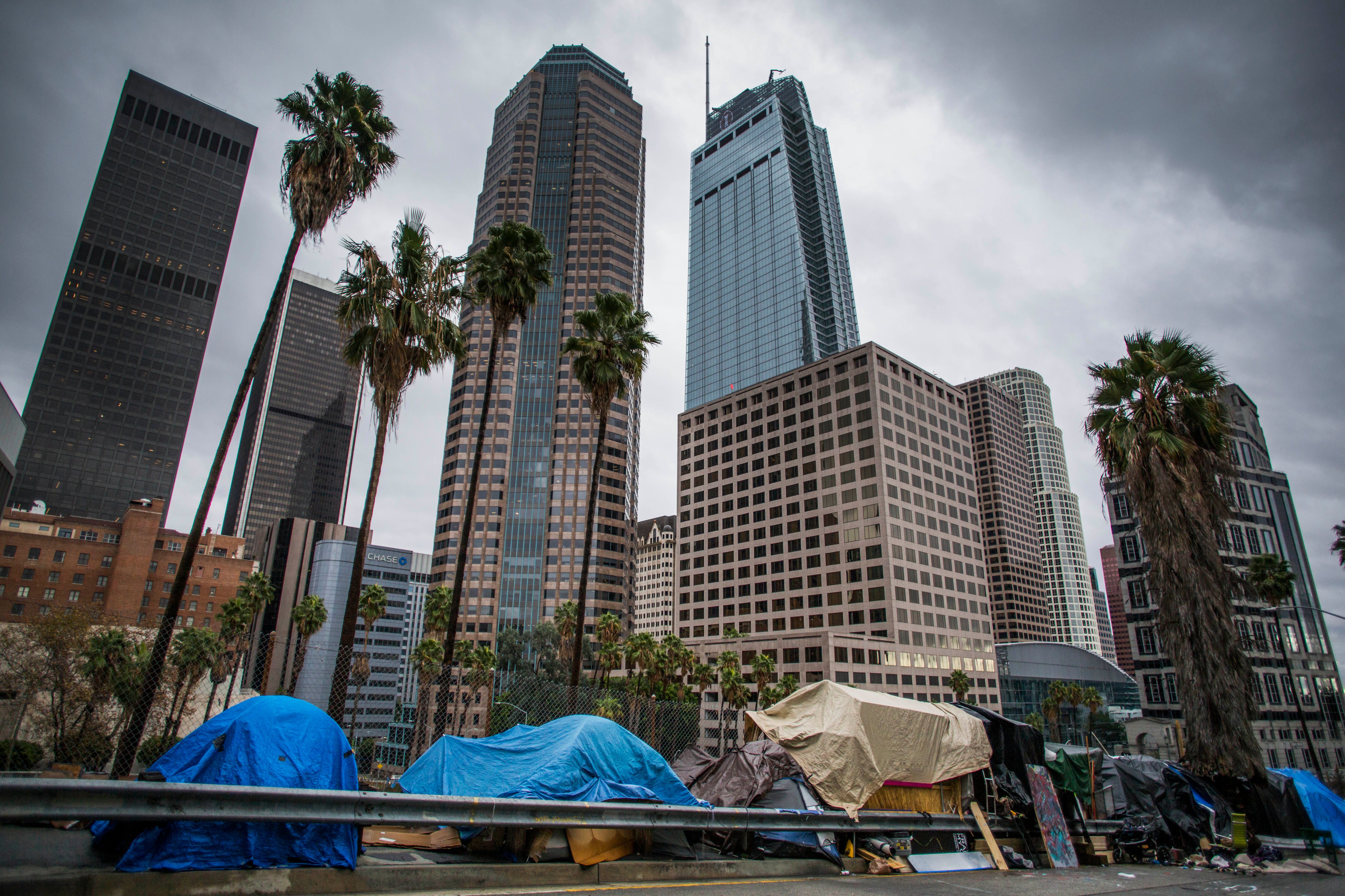 Tents line a freeway ramp in downtown Los Angeles on Thanksgiving Day, Nov. 28, 2019. (Credit: Apu Gomes / AFP / Getty Images)