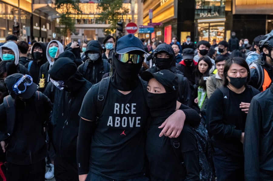 Protesters form a frontline during a standoff with police at a demonstration on Dec. 8, 2019, in Hong Kong, China. (Credit: Anthony Kwan/Getty Images)