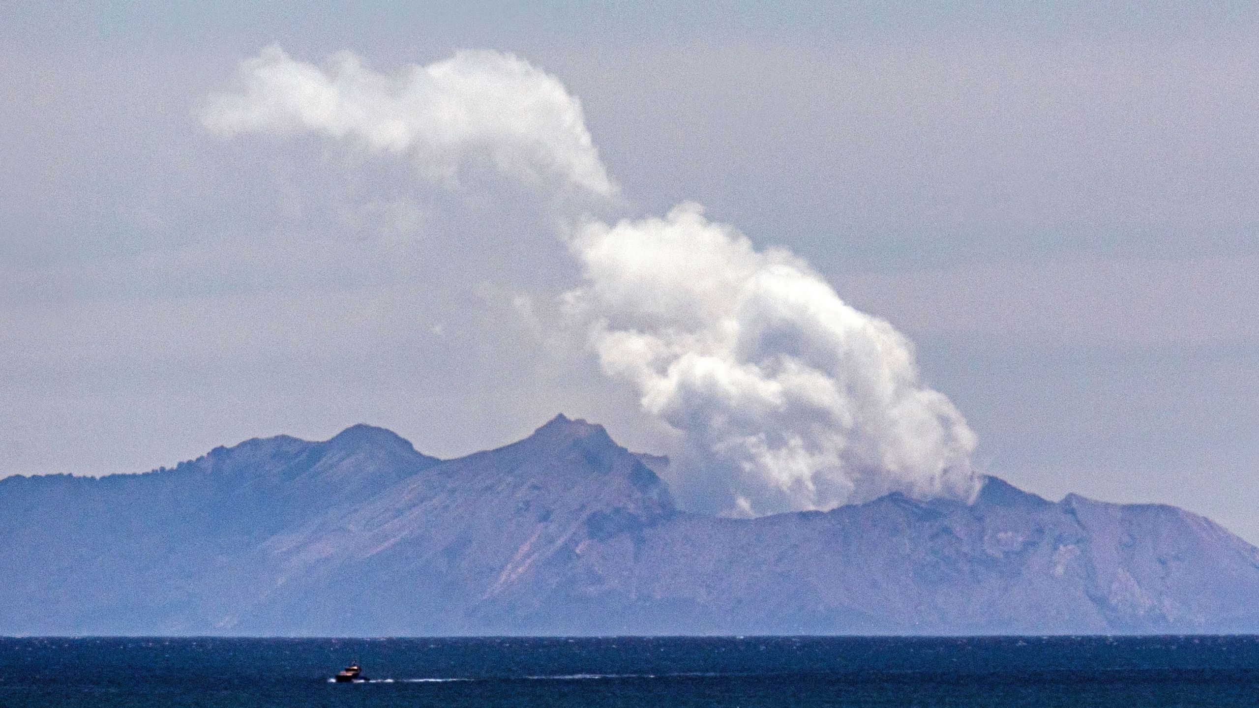 Steam rises from the White Island volcano following the Dec. 9 volcanic eruption in Whakatane on Dec. 11, 2019. (Credit: Marty Melville / AFP / Getty Images)