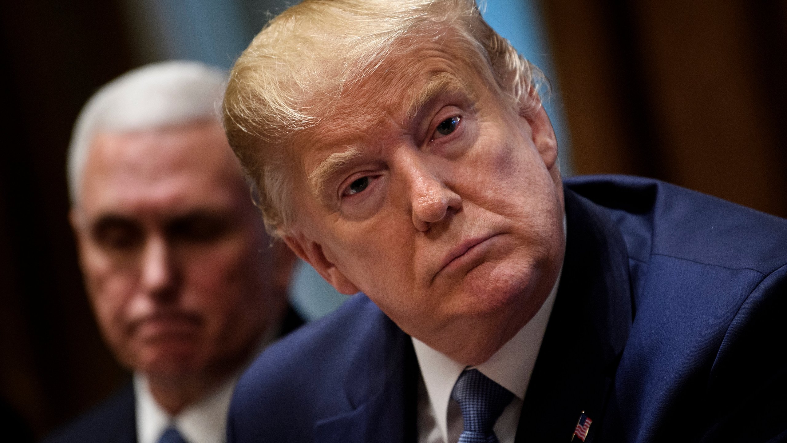 US Vice President Mike Pence and US President Donald Trump attend a meeting in the Cabinet Room of the White House December 16, 2019, in Washington, DC. (Credit: BRENDAN SMIALOWSKI/AFP via Getty Images)