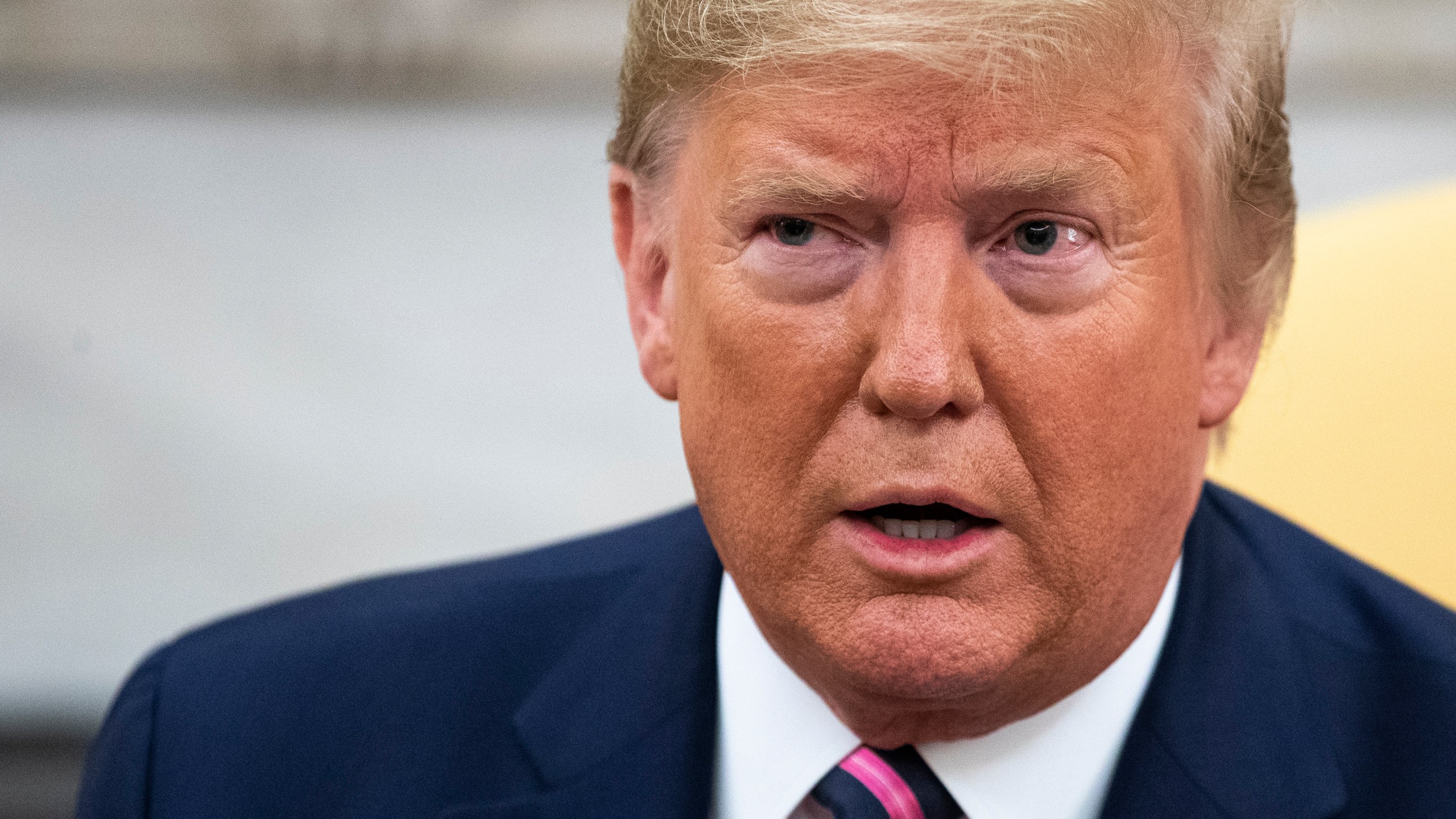 U.S. President Donald Trump speaks to reporters in the Oval Office of the White House on December 19, 2019 in Washington, DC. (Credit: Drew Angerer/Getty Images)