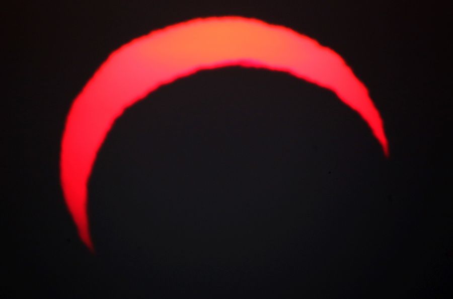 This picture taken early on Dec. 26, 2019 shows a view of the sun in Kuwait City during the partial solar eclipse event. (Credit: YASSER AL-ZAYYAT/AFP via Getty Images)