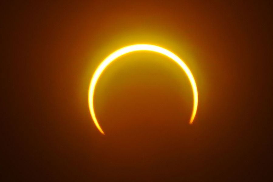 The moon moves in front of the sun in a rare "ring of fire" solar eclipse as seen from Balut Island, Saraggani province in the southern island of Mindanao on Dec. 26, 2019. (Credit: FERDINANDH CABRERA/AFP via Getty Images)