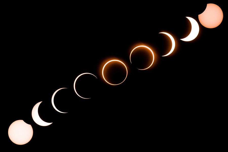 This composite image shows the moon as it moves in front of the sun in a rare "ring of fire" solar eclipse as seen from Tanjung Piai in Malaysia on December 26, 2019. (Credit: SADIQ ASYRAF/AFP via Getty Images)