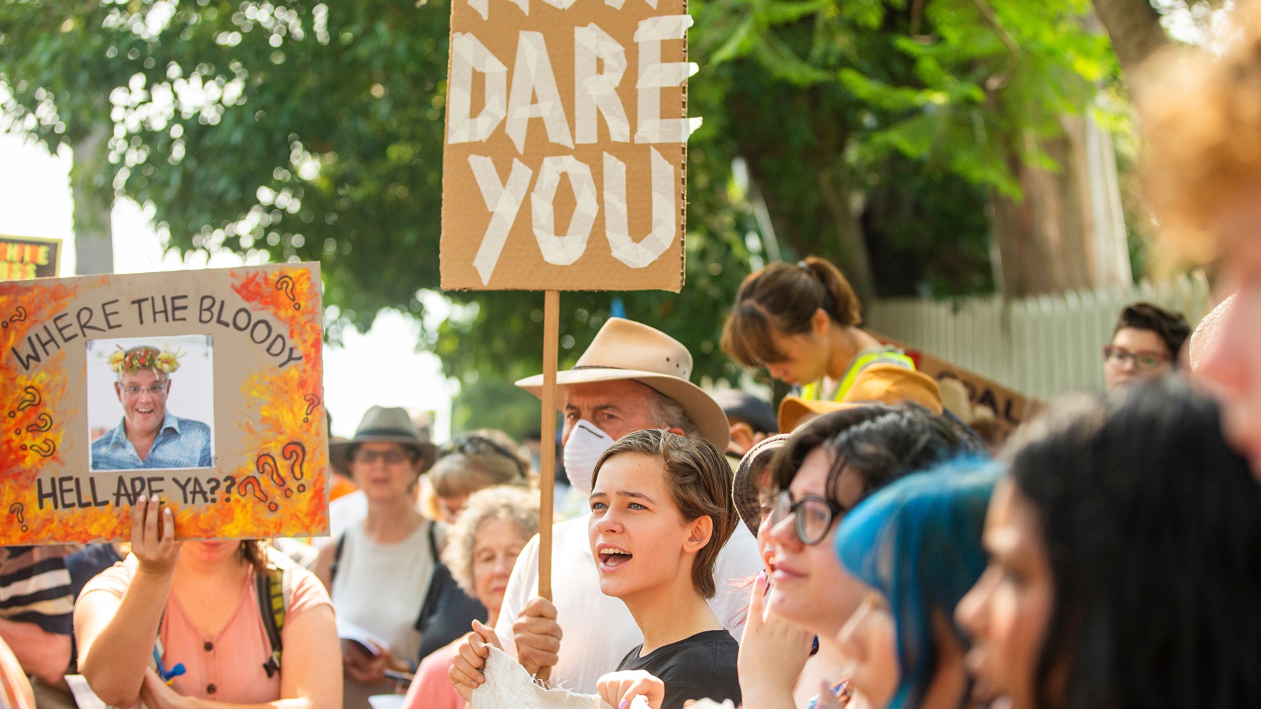 Protestors hold up banners during a protest at Kirribilli House on Dec. 19, 2019 in Sydney, Australia. Protestors organized the rally outside Prime Minister Scott Morrison's Sydney residence over his absence during the ongoing bushfire emergencies across Australia. (Credit: Jenny Evans/Getty Images)