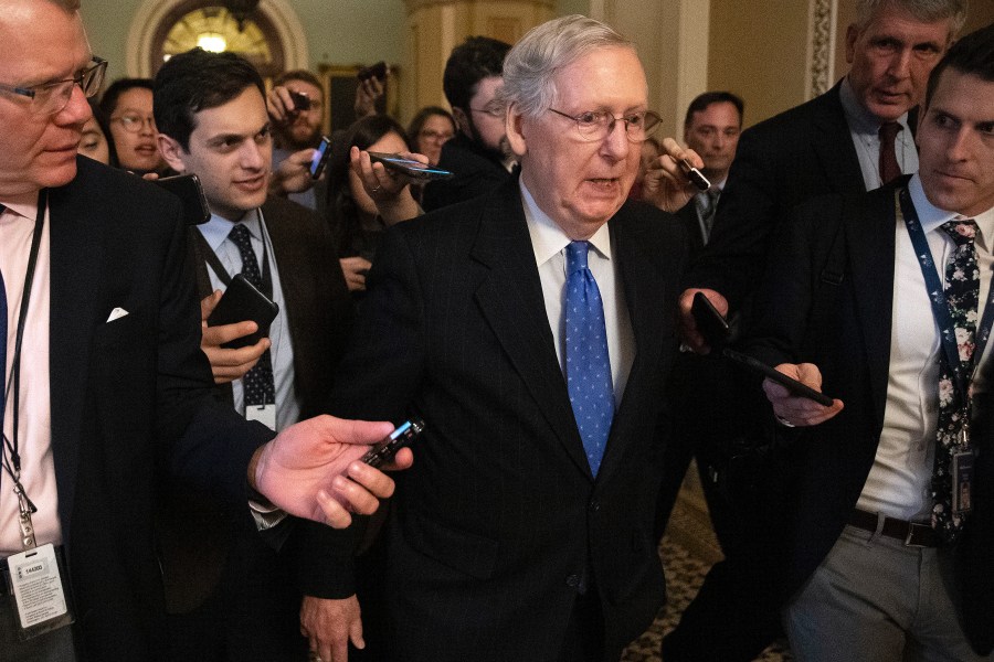 Senate Majority Leader Mitch McConnell (R-KY) is surrounded by journalists as he walks back to his office in the U.S. Capitol on Dec. 19, 2019, in Washington, D.C. The Senate passed legislation funding the federal government through the next fiscal year before leaving for the holiday break. (Credit: Chip Somodevilla/Getty Images)